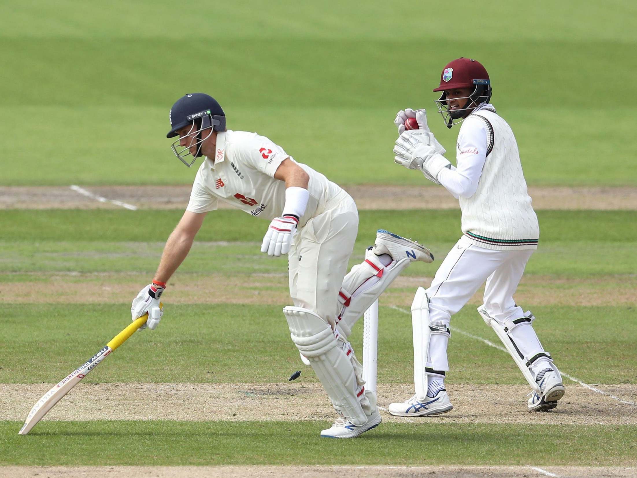Joe Root is run out by Roston Chase, not pictured