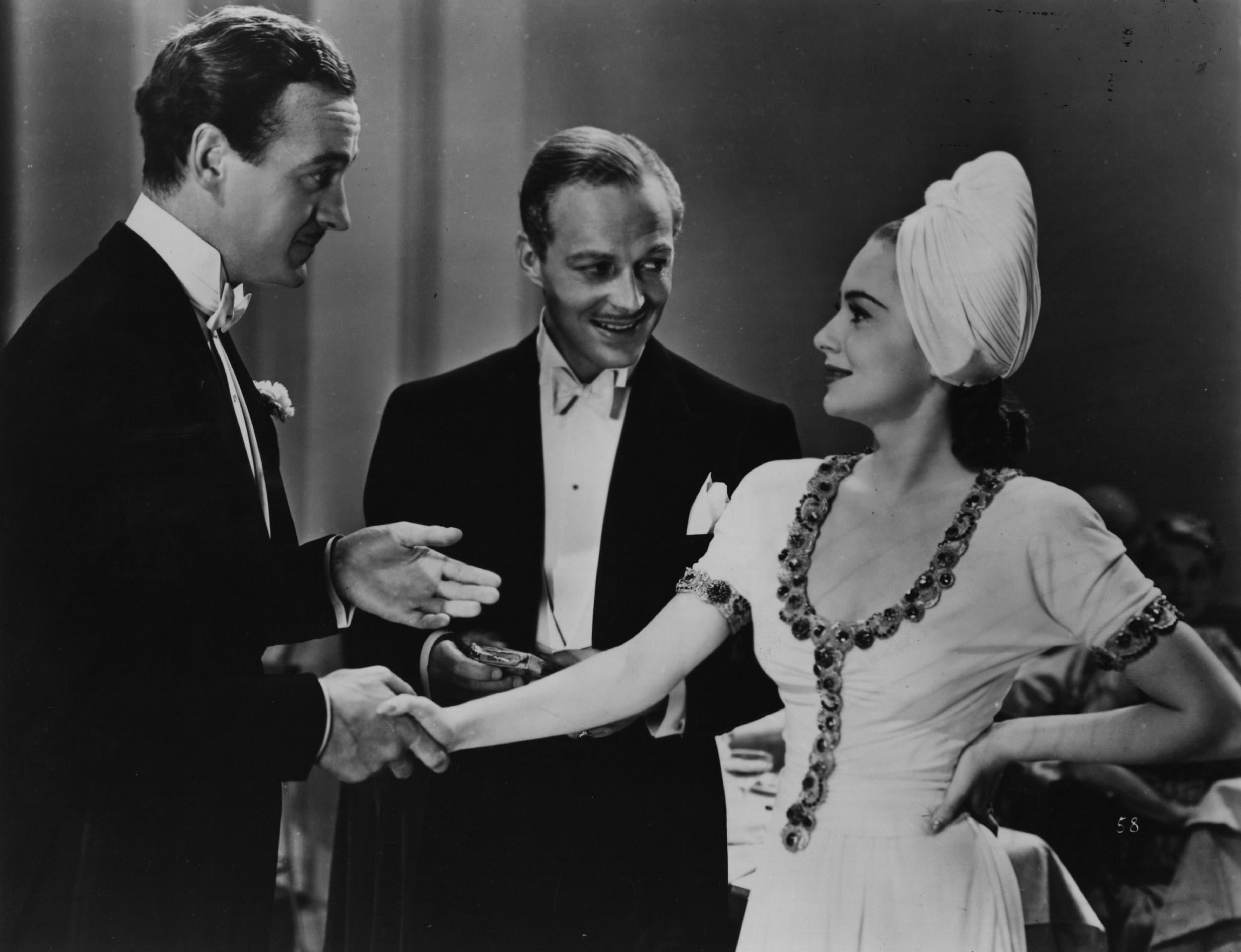 Olivia de Havilland with David Niven, left, and Douglas Walton in the 1939 film Raffles