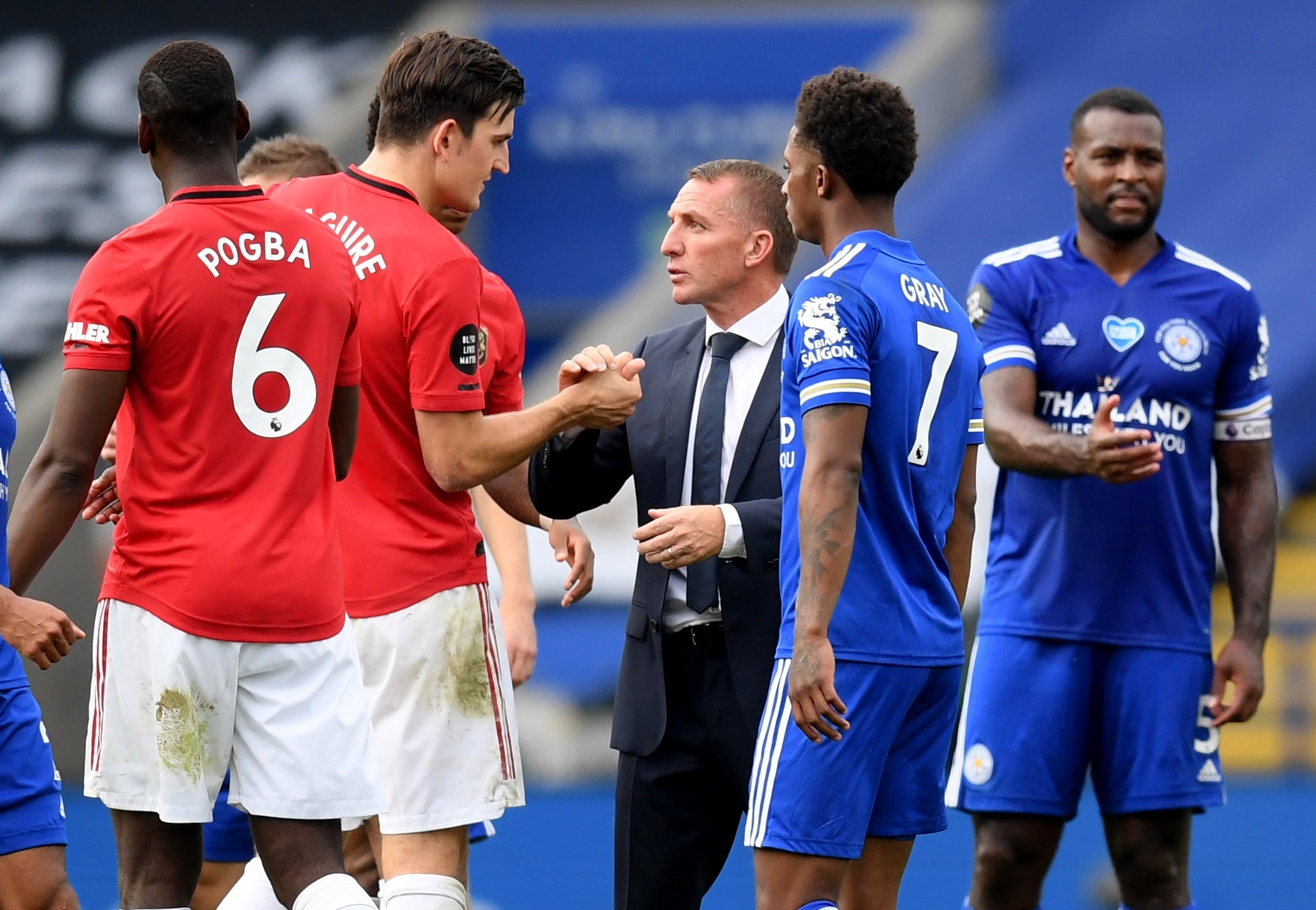 Brendan Rodgers shakes hands with former Leicester defender Harry Maguire (Reuters)