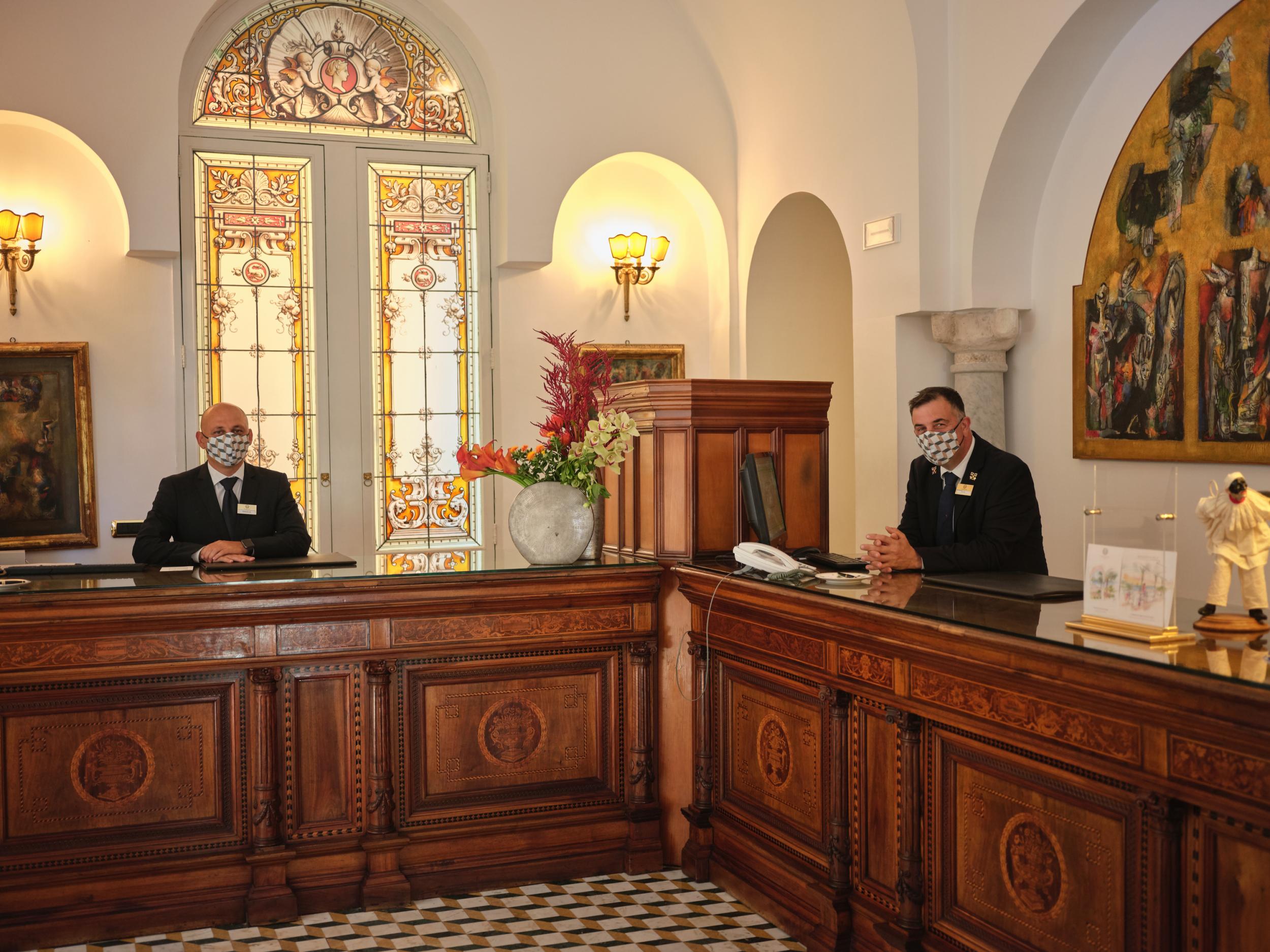 Clerks wait for guests to check-in at the Palazzo Avino in Ravello