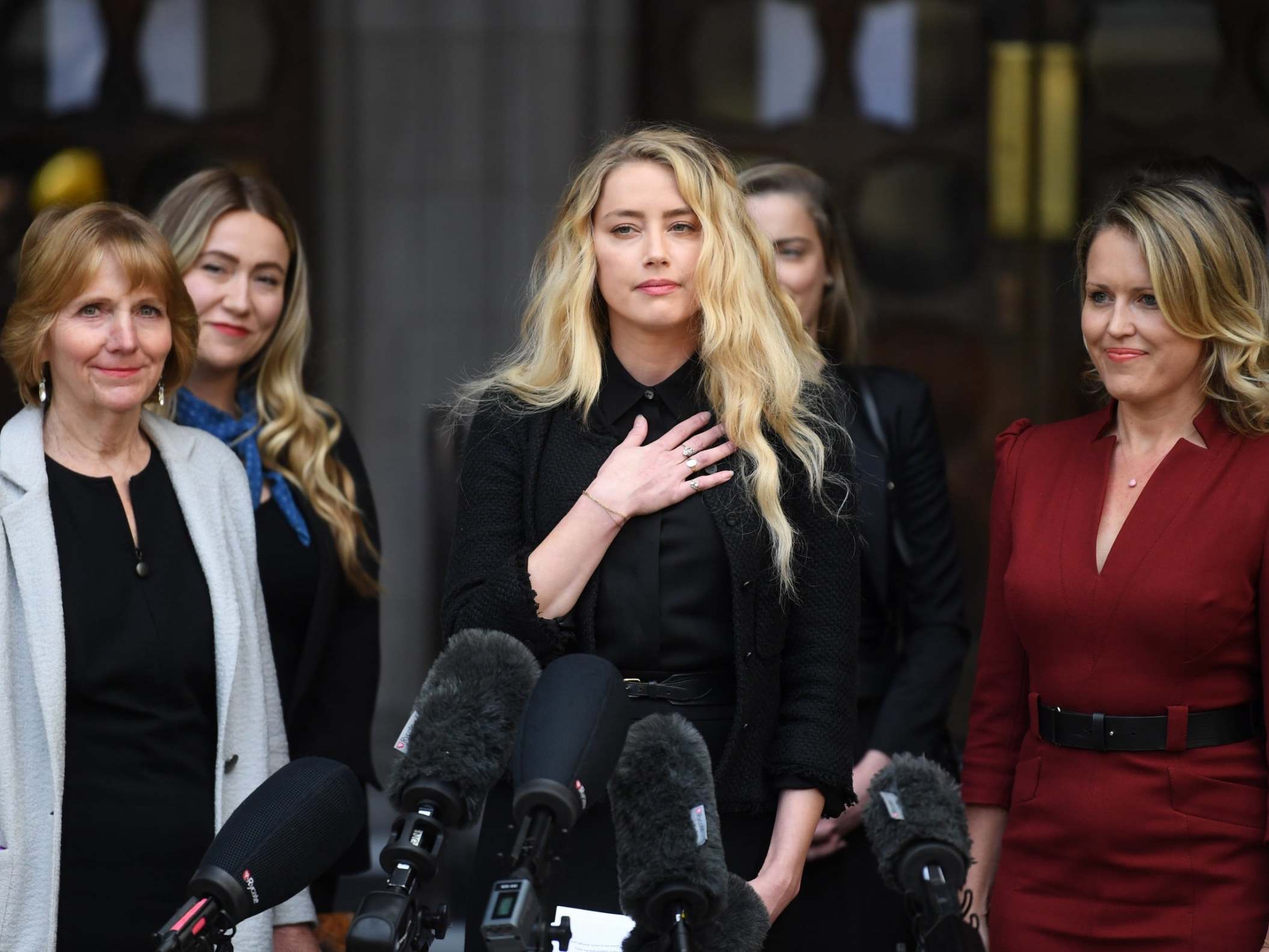 US actress Amber Heard (centre) gives a statement outside the Royal Courts of Justice in London as actor Johnny Depp’s libel trial draws to and end, 28 July 2020.