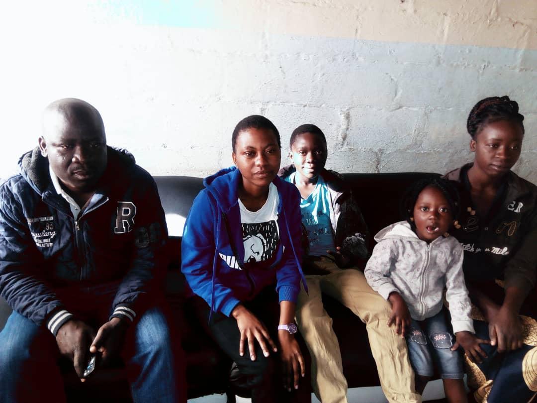 Julius Miyengo at home with his sisters, son and niece