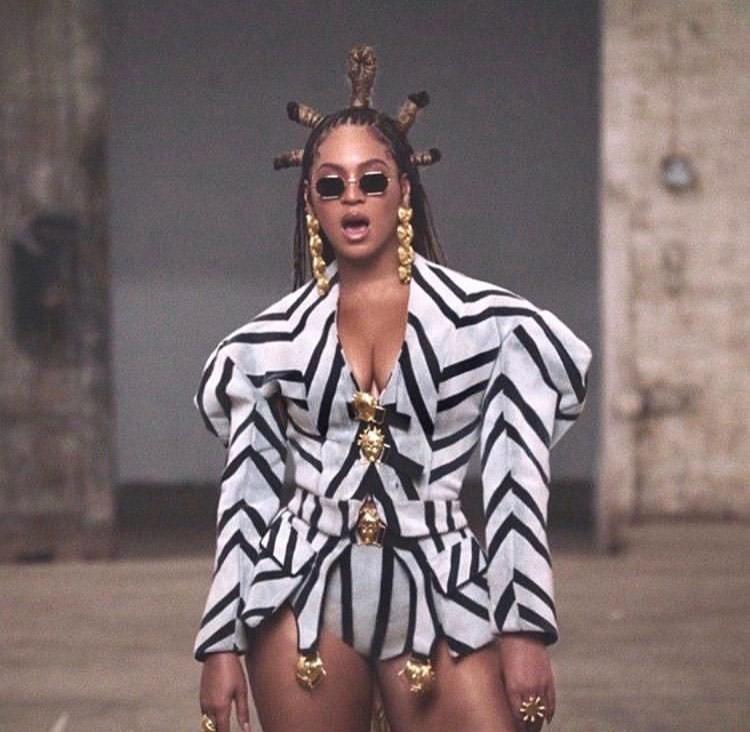 Beyoncé's dramatic shoulder padded blazer is a custom piece from Côte d’Ivoire-based designer Ivorian Loza Maléombho, whose SS16 collection appeared on backup dancers in the “Formation” video.