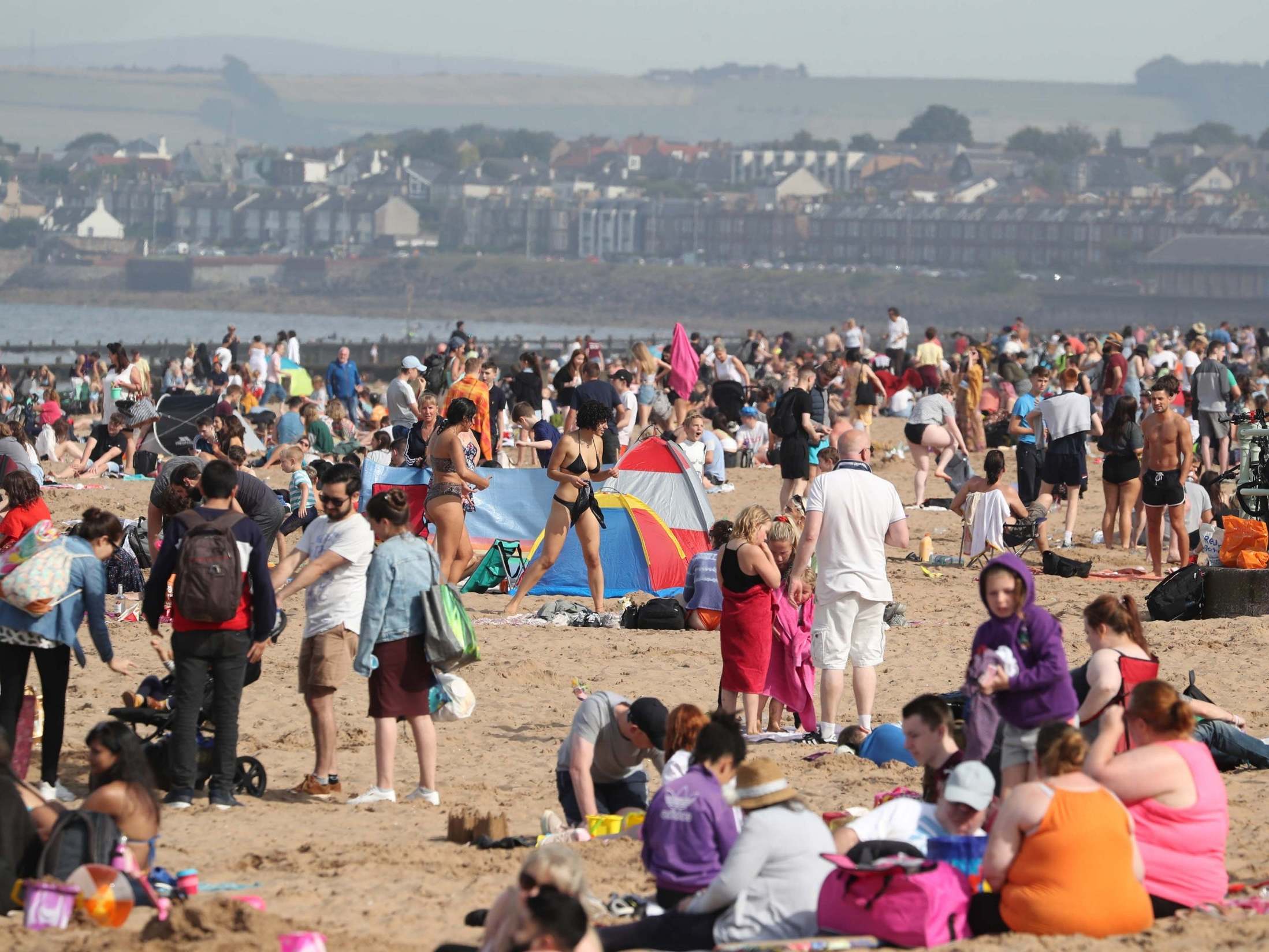 People enjoying the weather on Portobello Beach in Edinburgh