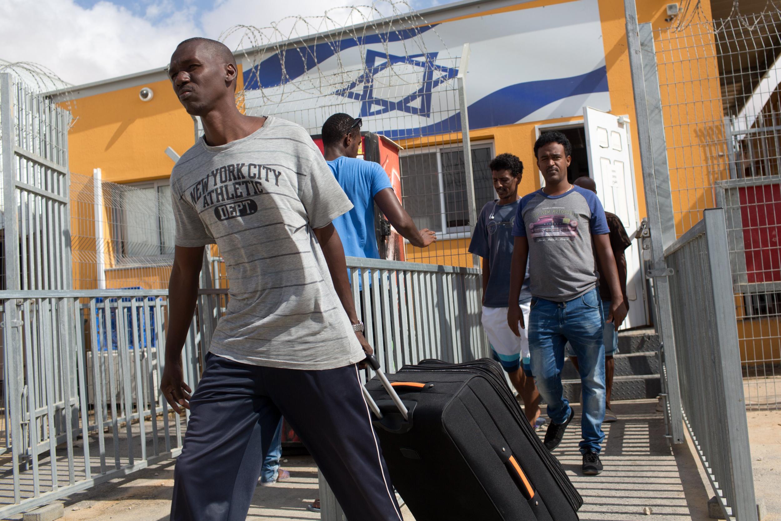 African illegal immigrants leave Holot Detention Centre in Israel’s Negev desert after being released