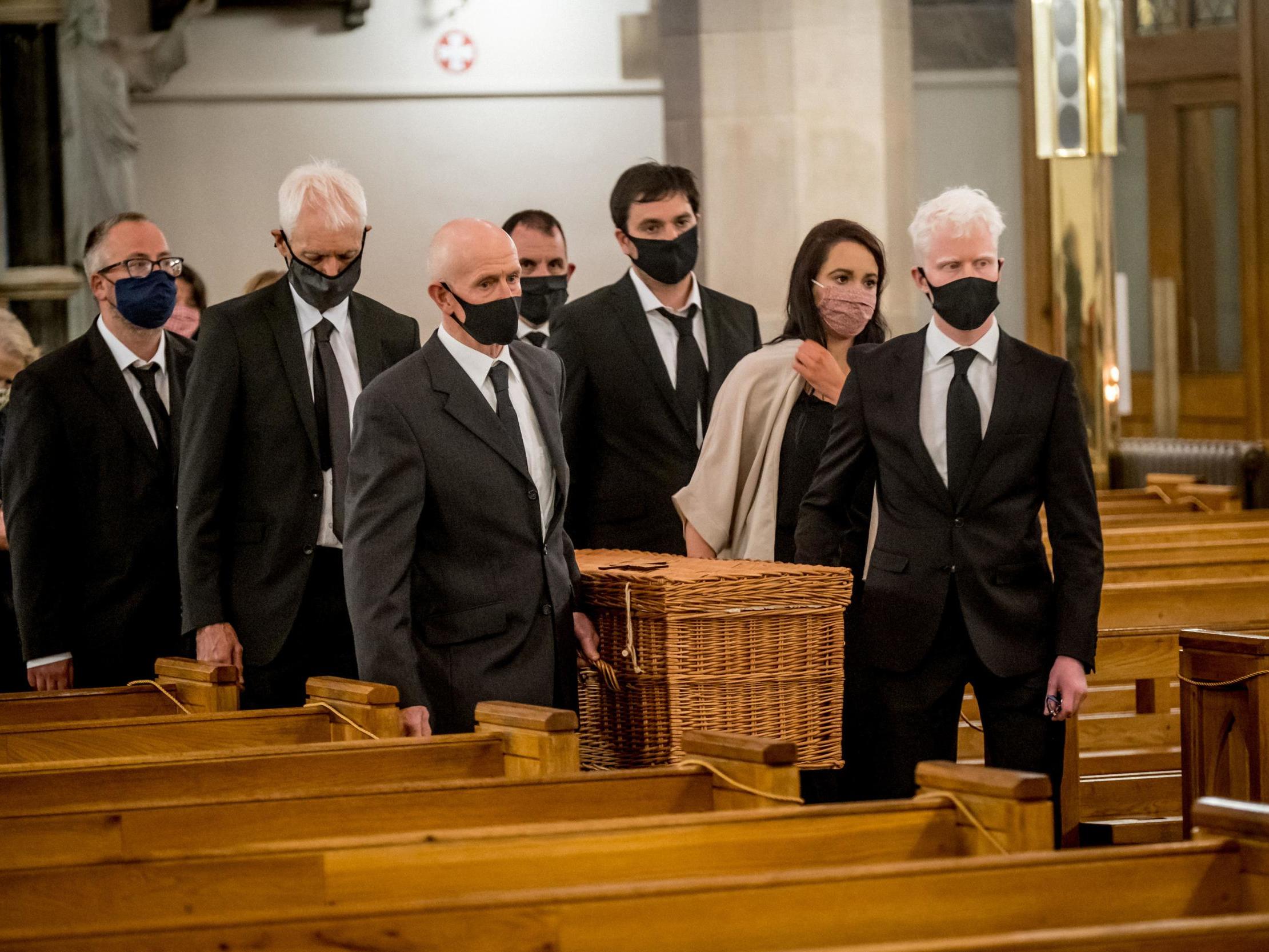 Members of the family carry John Hume’s remains