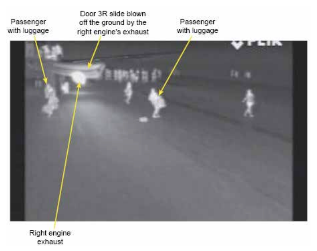 Bad practice: an infra-red photograph of the evacuation scene at Stansted airport in which passengers took cabin baggage off the plane