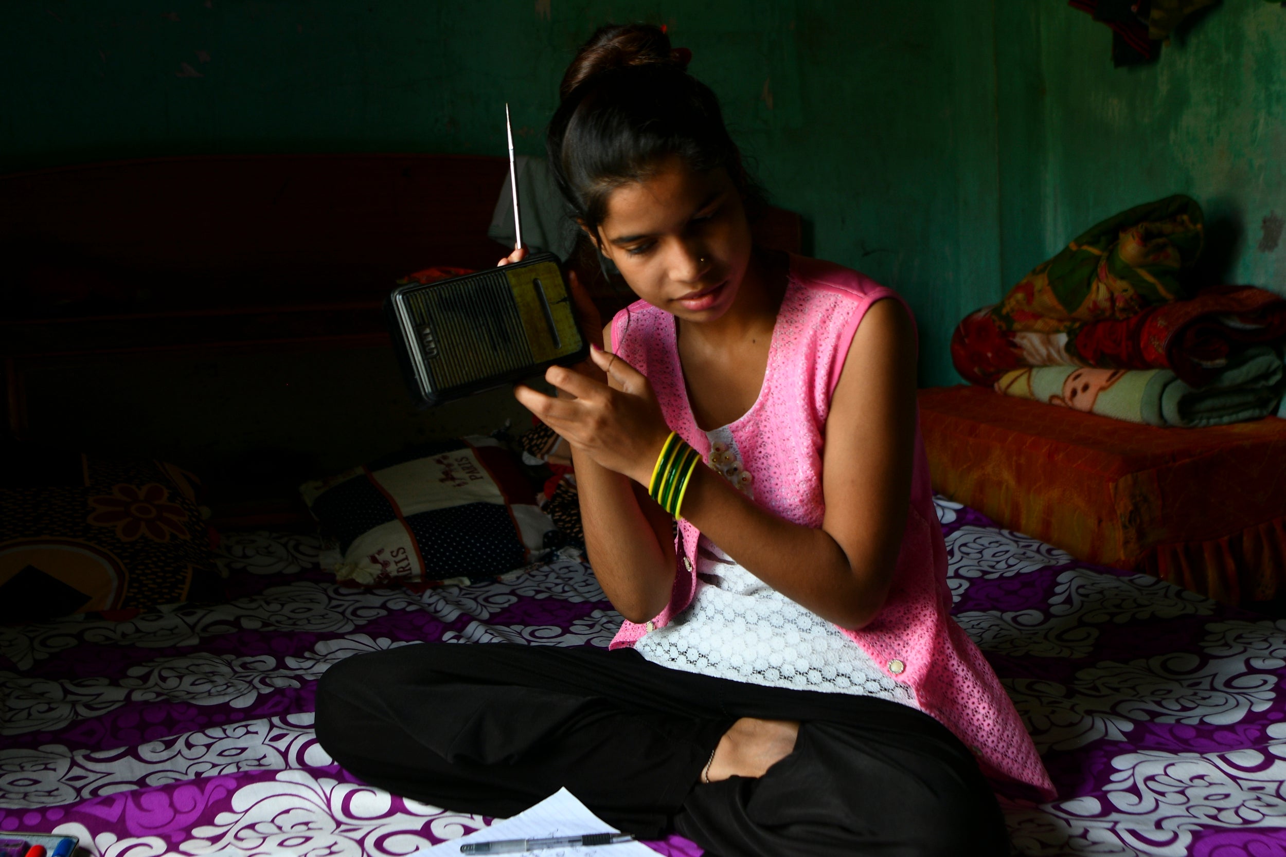 ‘Little sister' Anjali Patel listens to an educational radio programme in Bahubari. ‘My ‘big sister’ is the closest person I can share my problems with,’ Anjali says. ‘She stays in the same community and comes to my home for regular mentoring. Through mentoring, Muni has helped me in my lessons and provides me with information on health, hygiene and life skills. I look up to her in life which gives me the confidence to be empowered’