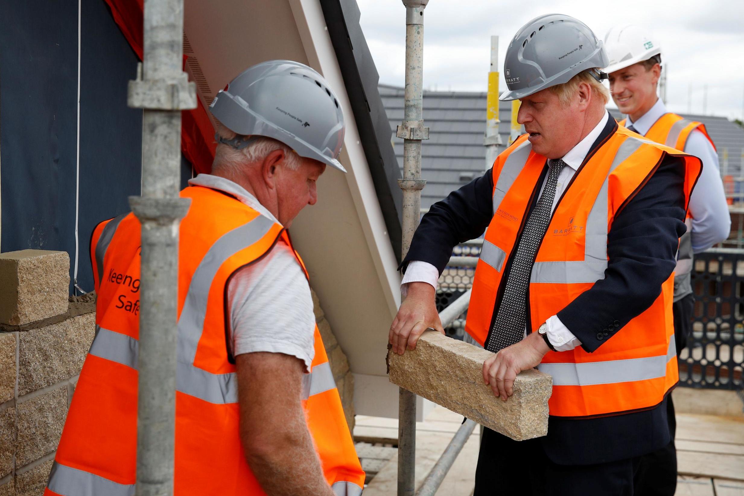 Johnson visiting a construction site in Warrington last week, as his government announced a major overhaul of planning policy