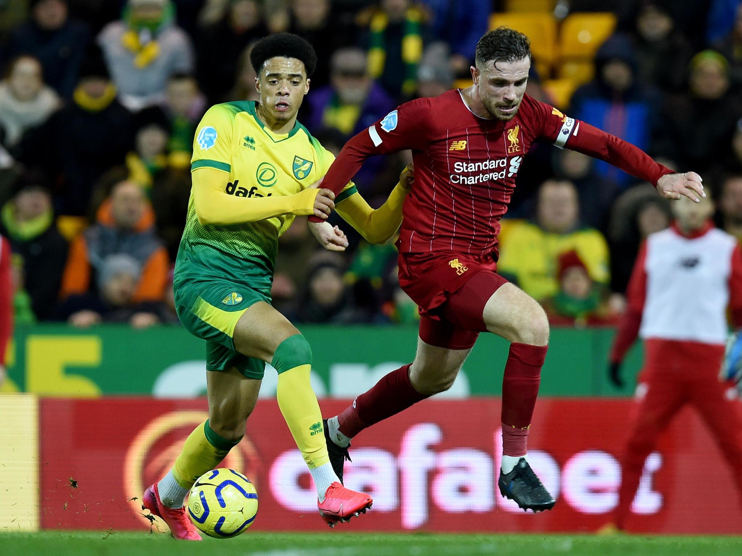 Jamal Lewis of Norwich battles with Jordan Henderson of Liverpool (Liverpool FC via Getty)