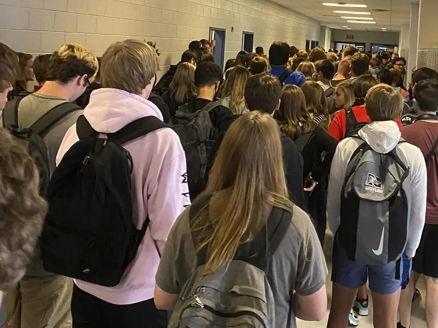 Students crowd a hallway, Tuesday, 4 August 2020, at North Paulding High School in Dallas, Georgia