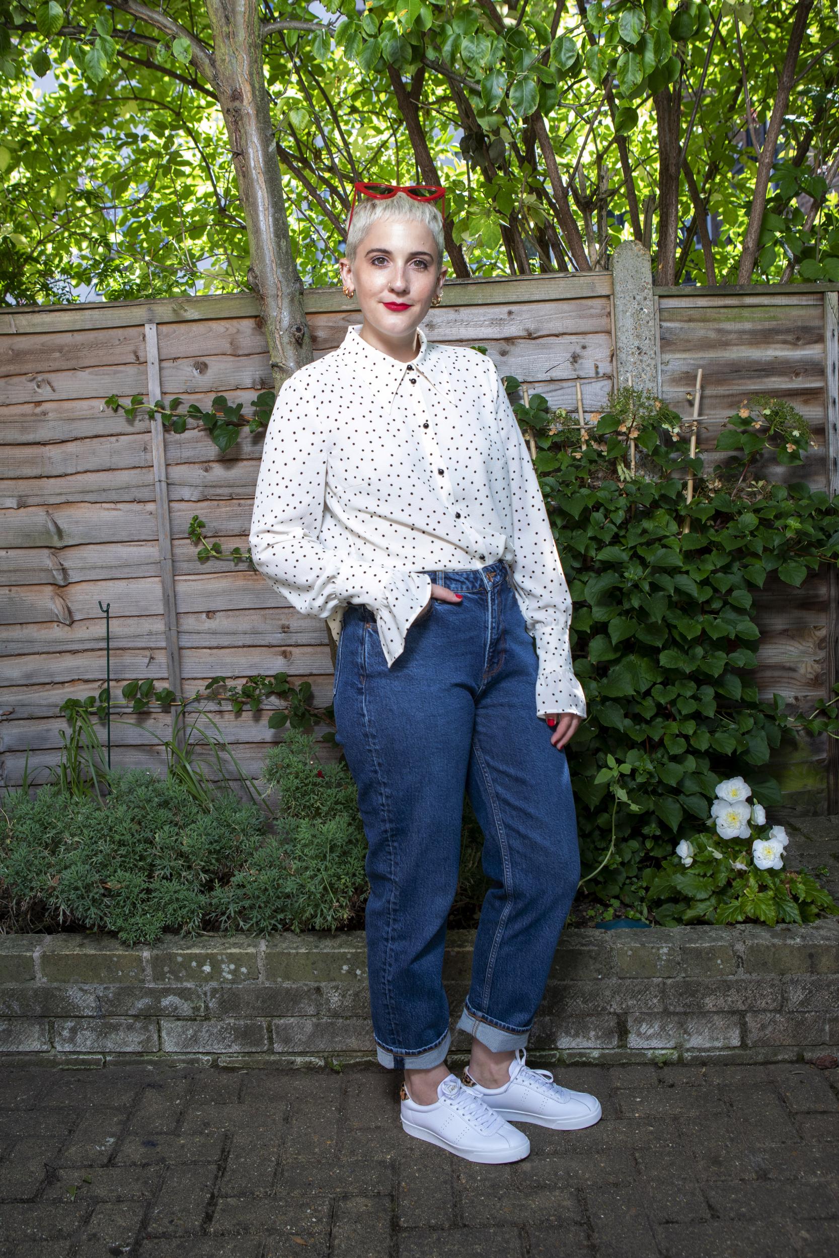 Harriet is wearing a Baum und Pferdgarten blouse, Samsøe Samsøe jeans and Superga trainers