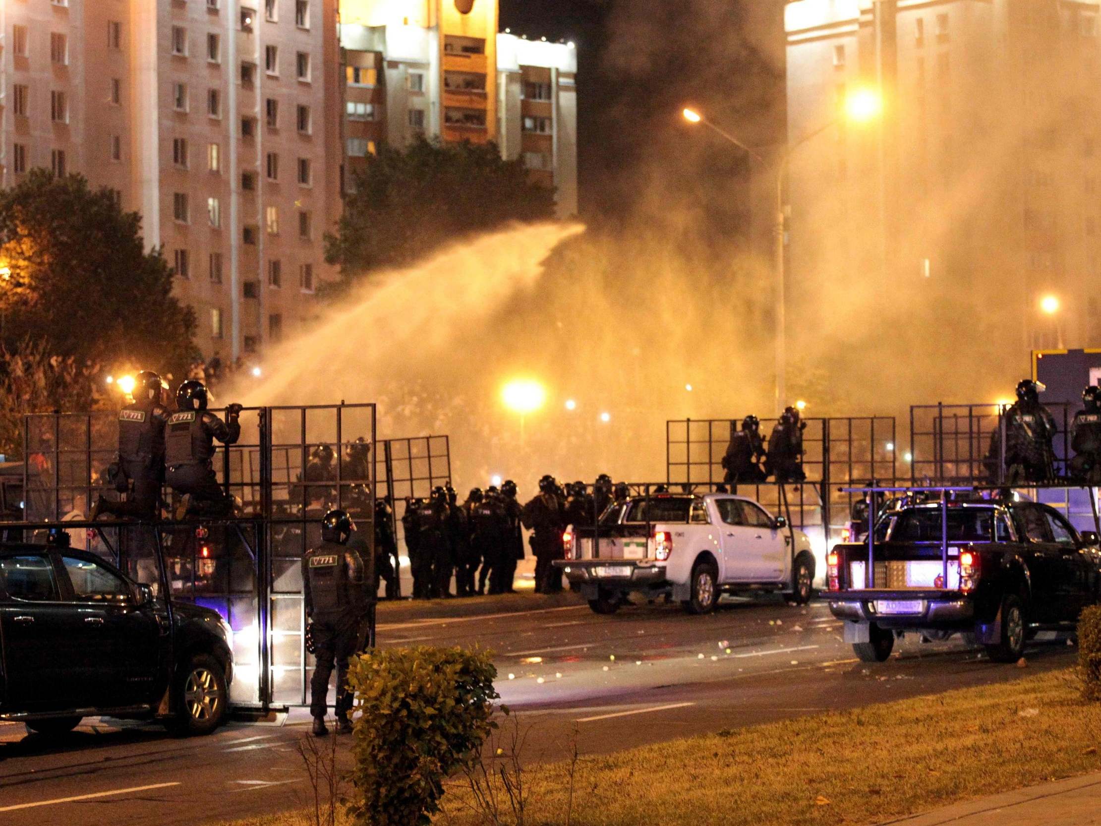 Riot police use a water cannon against protesters in Minsk after polls closed in Belarus’s presidential election (AFP via Getty)