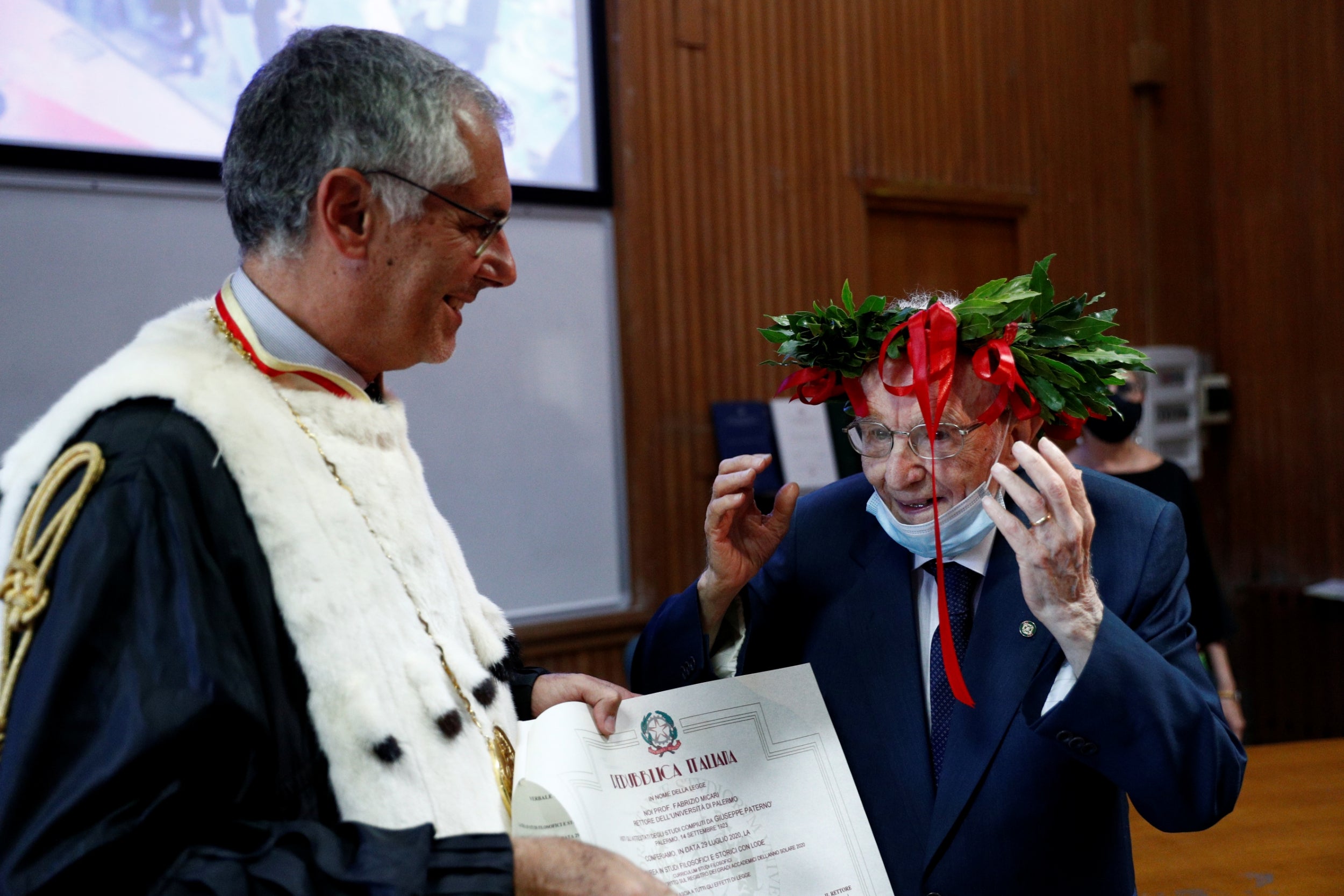 Paterno is awarded his graduation certificate