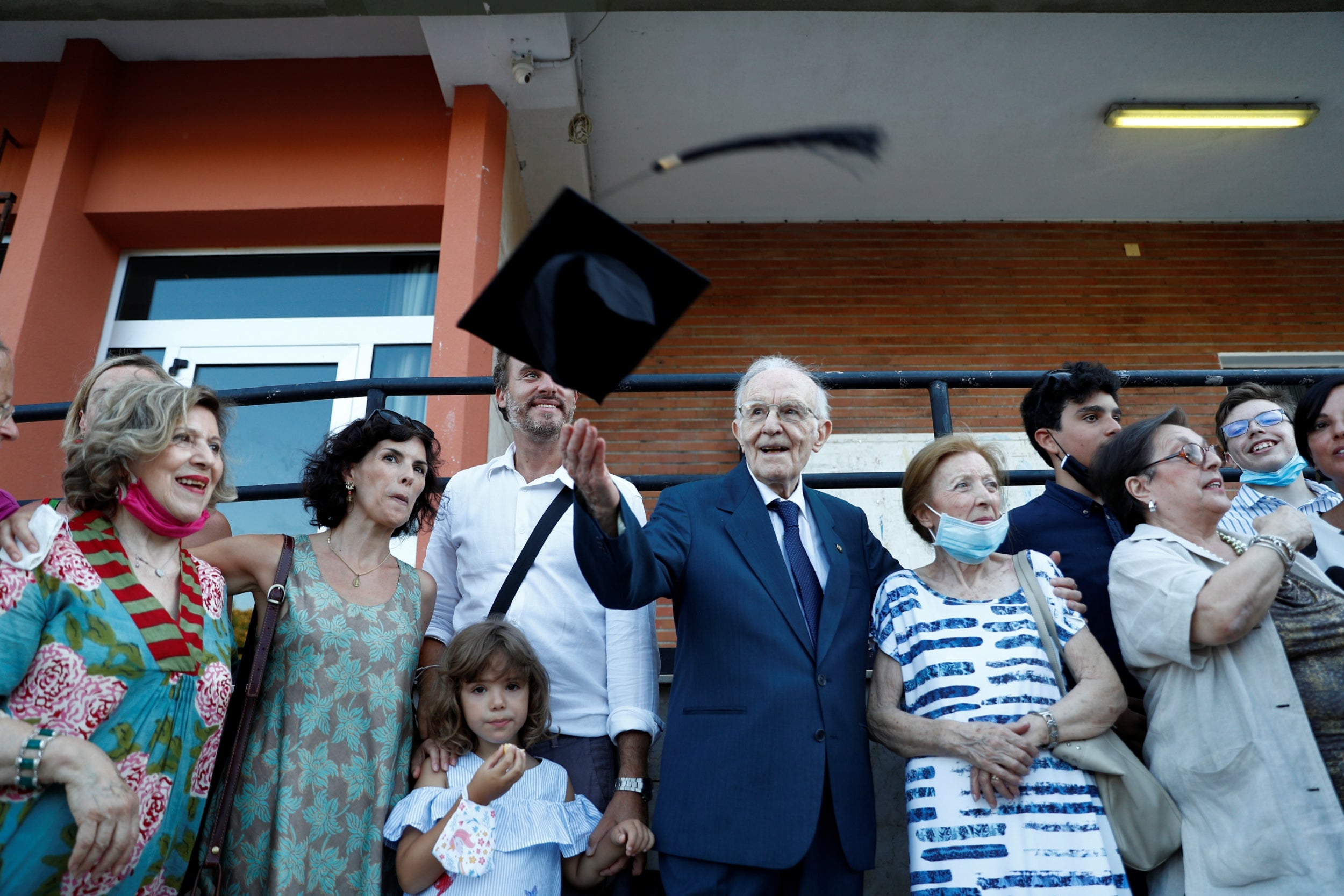 Paterno celebrates with his family after graduating