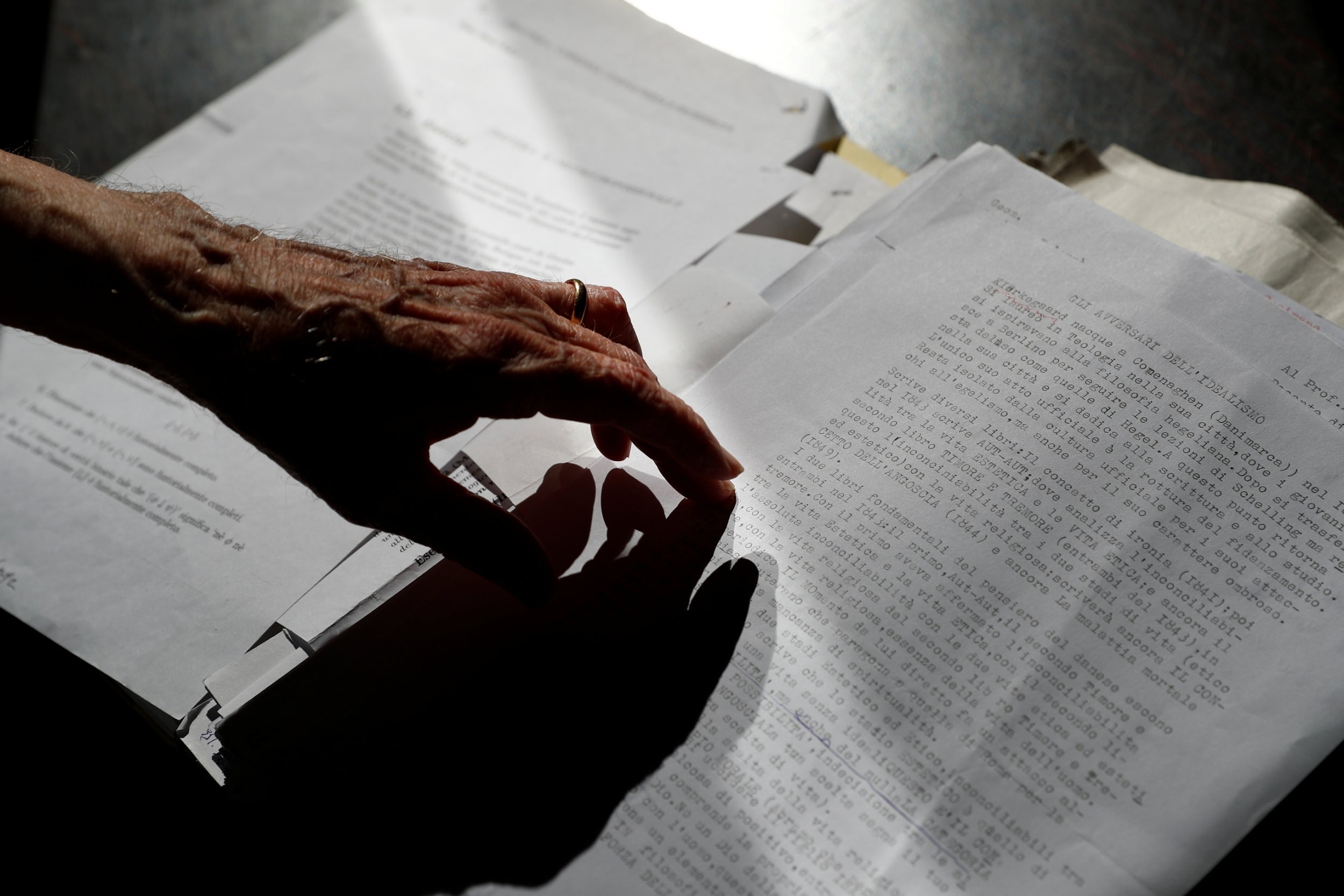 Paterno goes over his study notes at his desk