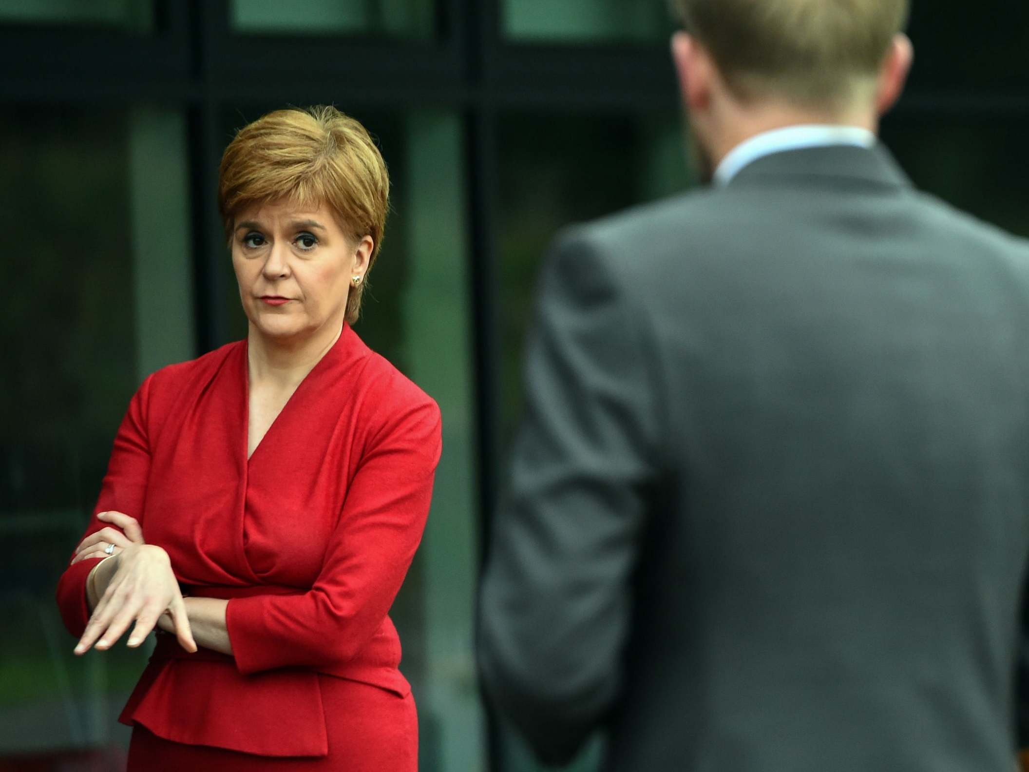 Nicola Sturgeon talks to staff at West Calder High School yesterday (AFP/Getty)