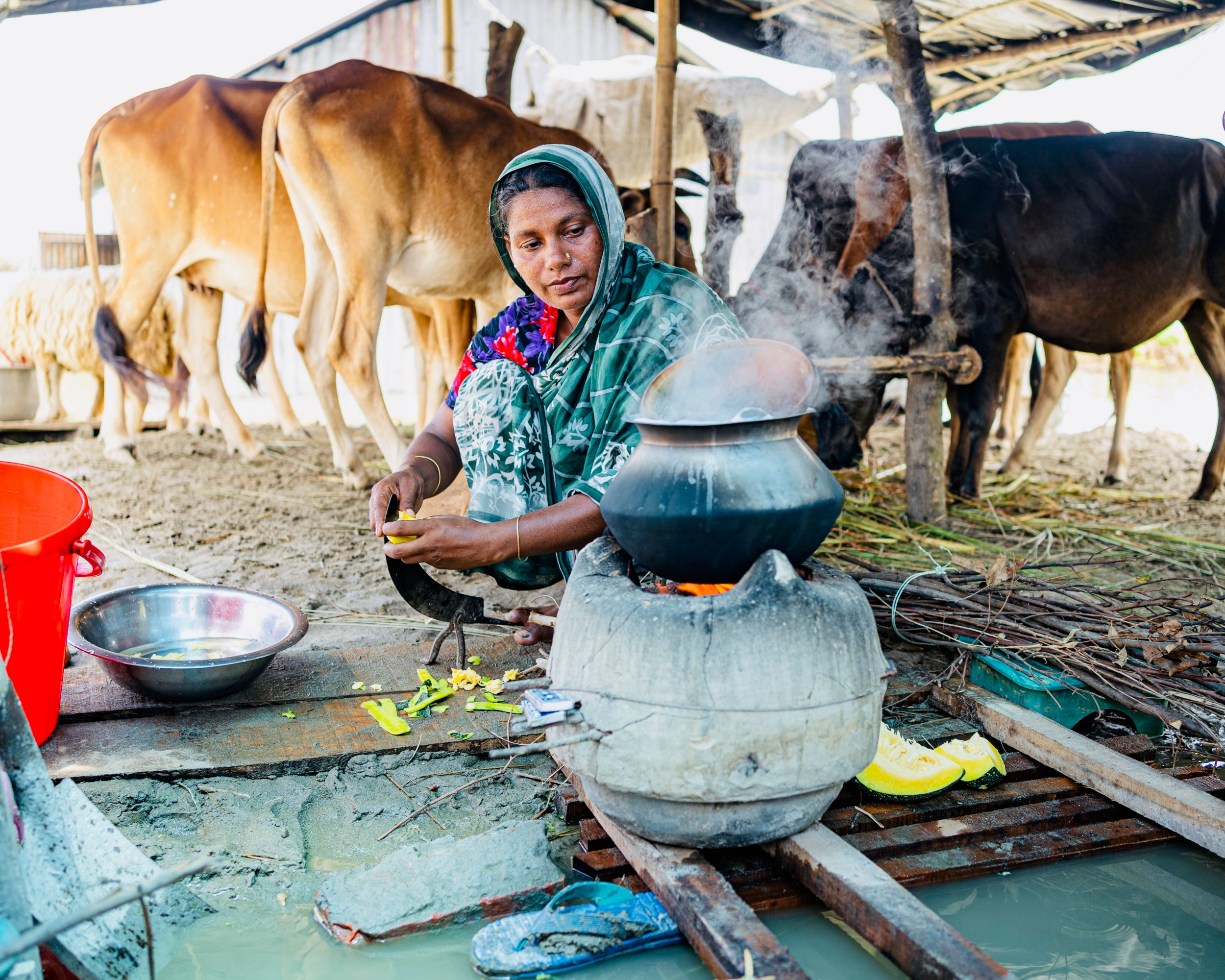 Rowshan Ara preparing lunch in her makeshift kitchen