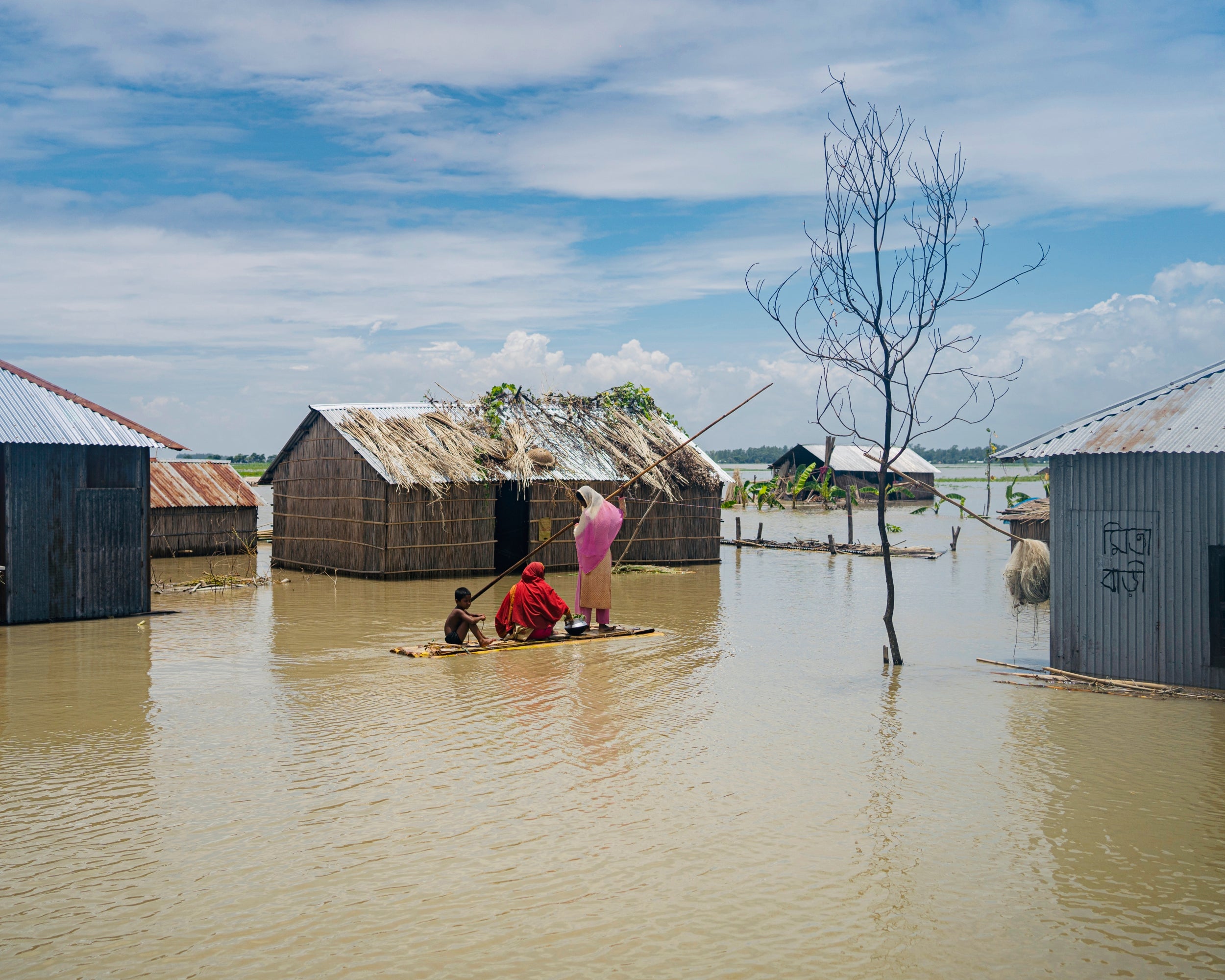 Boats and rafts made from banana trees are one of the only available modes of transportation during the floods