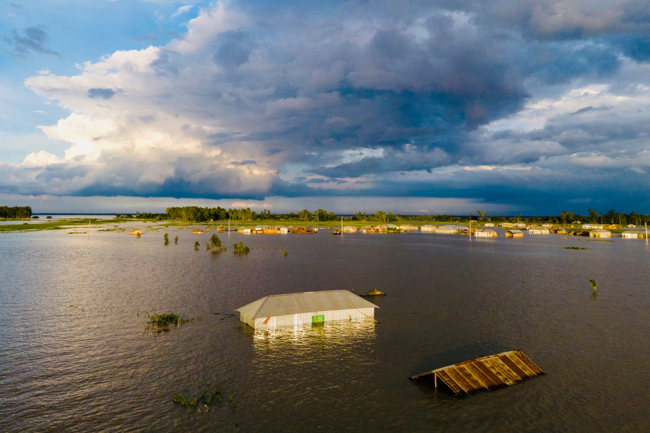 Floods submerge houses, leaving many residents marooned