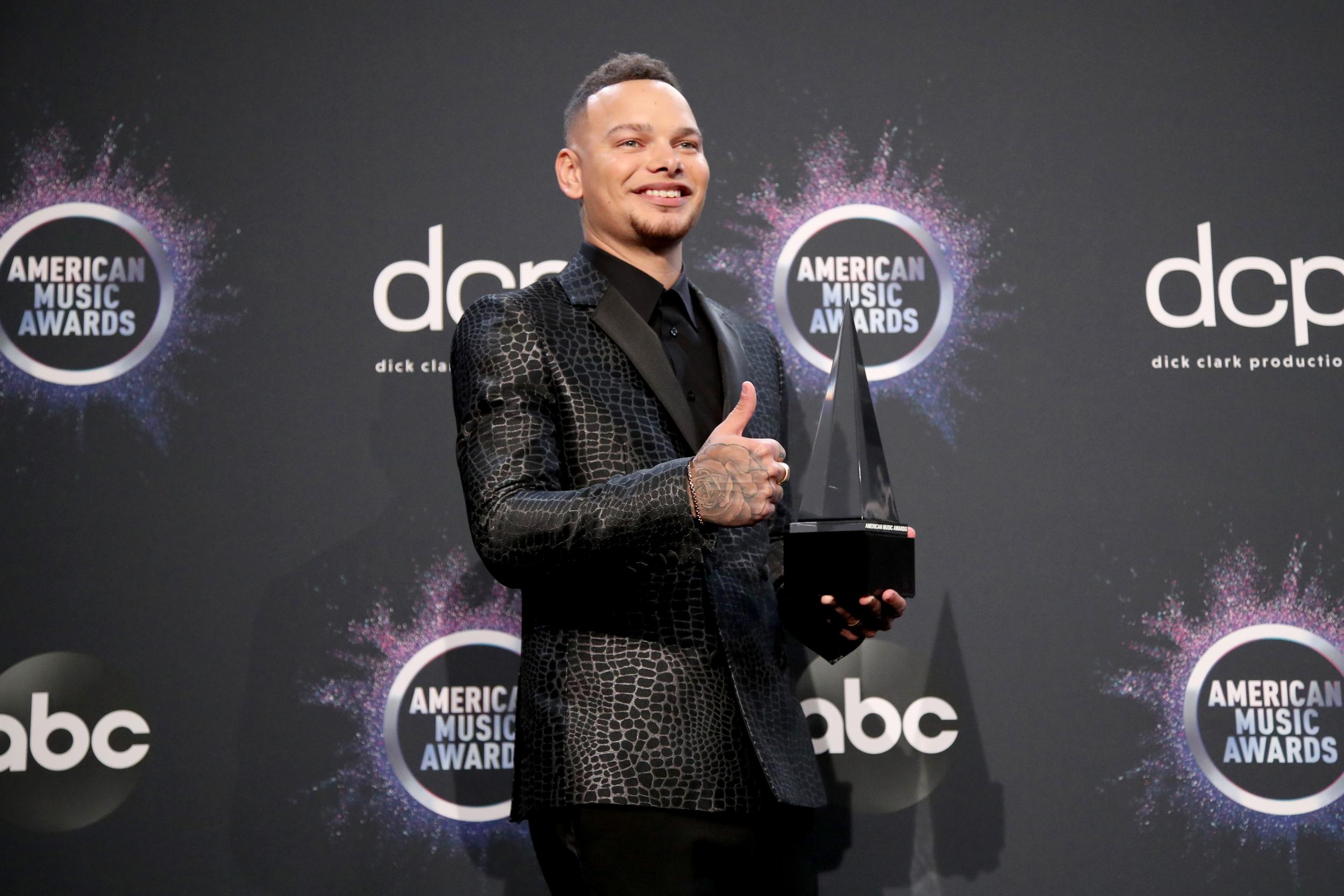 Kane Brown poses with his award after winning Favorite Male Artist Country on 24 November 2019 in Los Angeles, California.