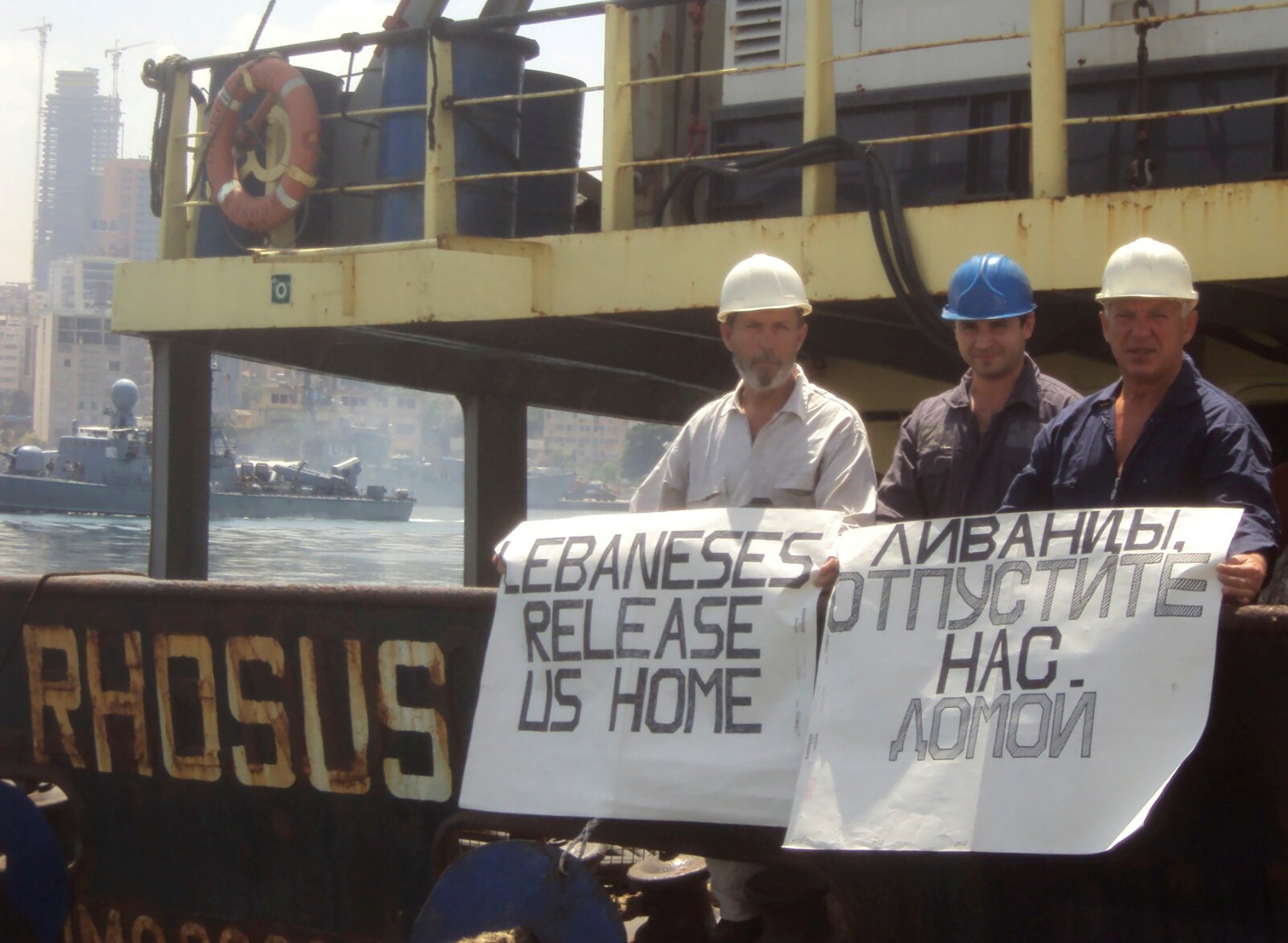 Captain Prokoshev and crew members demand their release from the arrested cargo vessel in 2014 (Reuters)