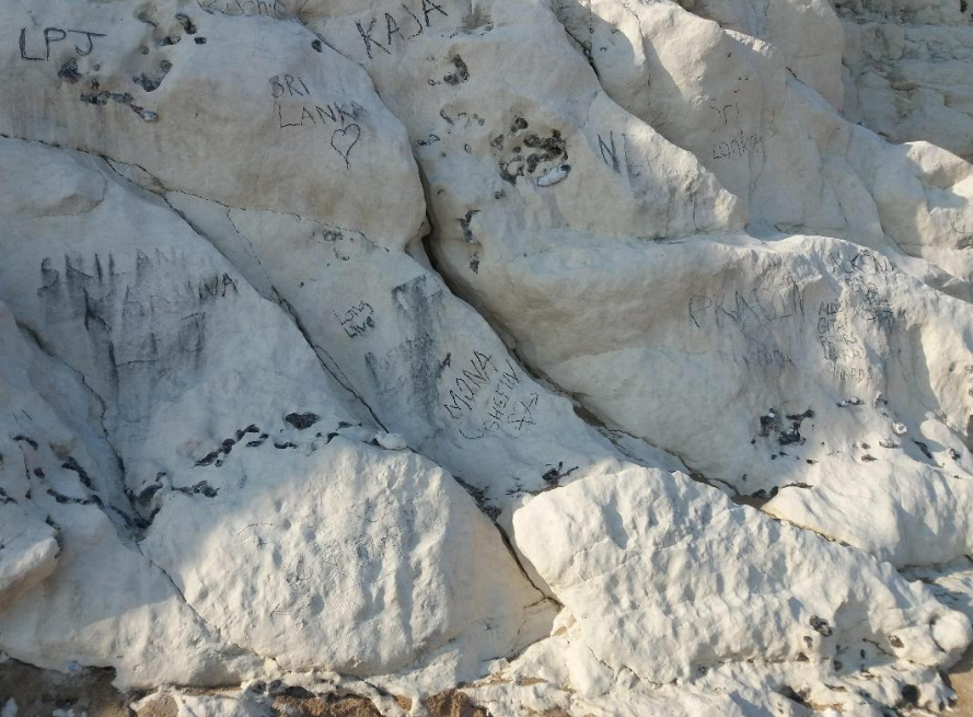 The cliffs at Durdle Door are regularly defaced