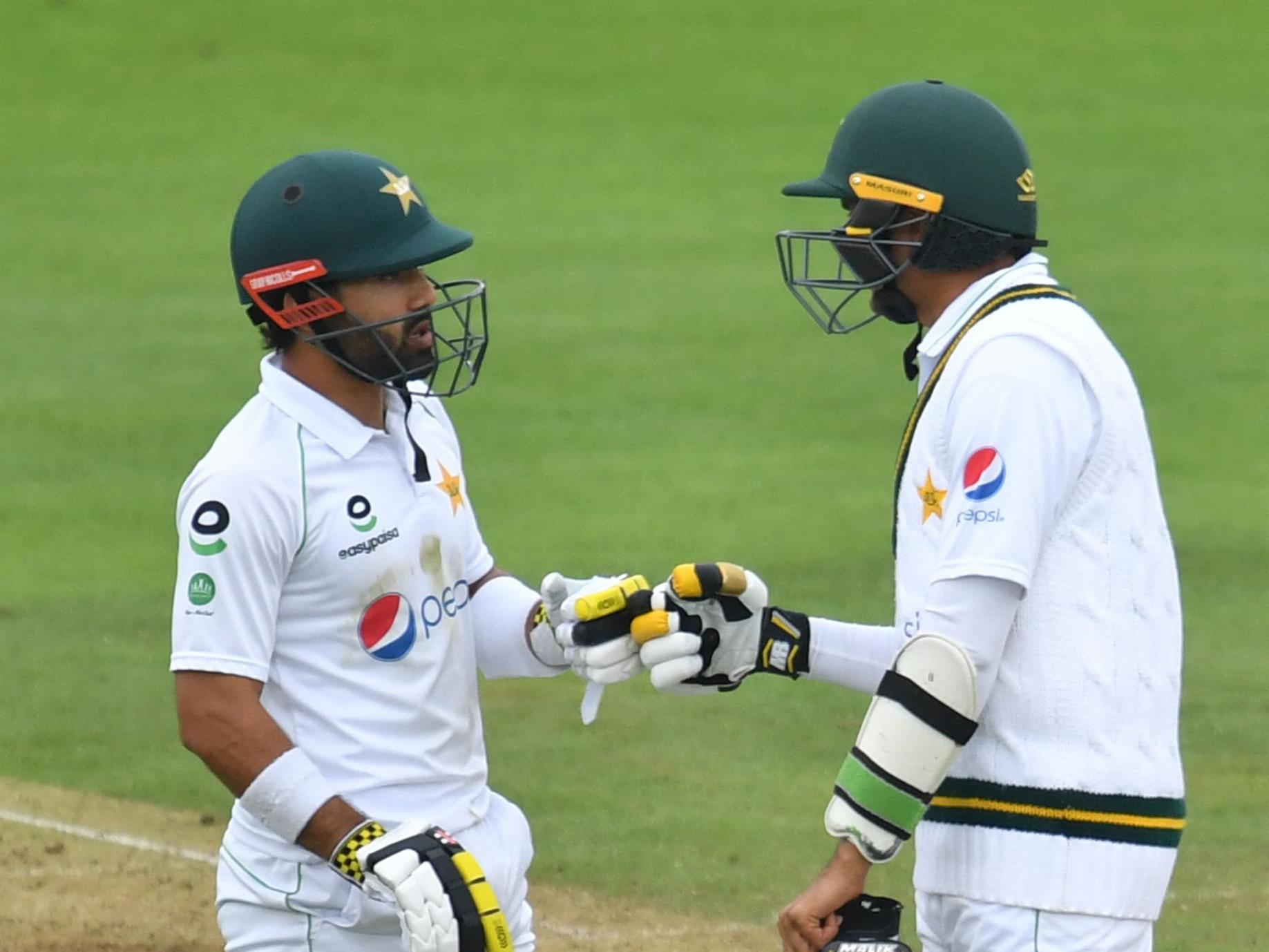 Pakistan’s Mohammad Rizwan (left) and Mohammad Abbas talk between overs