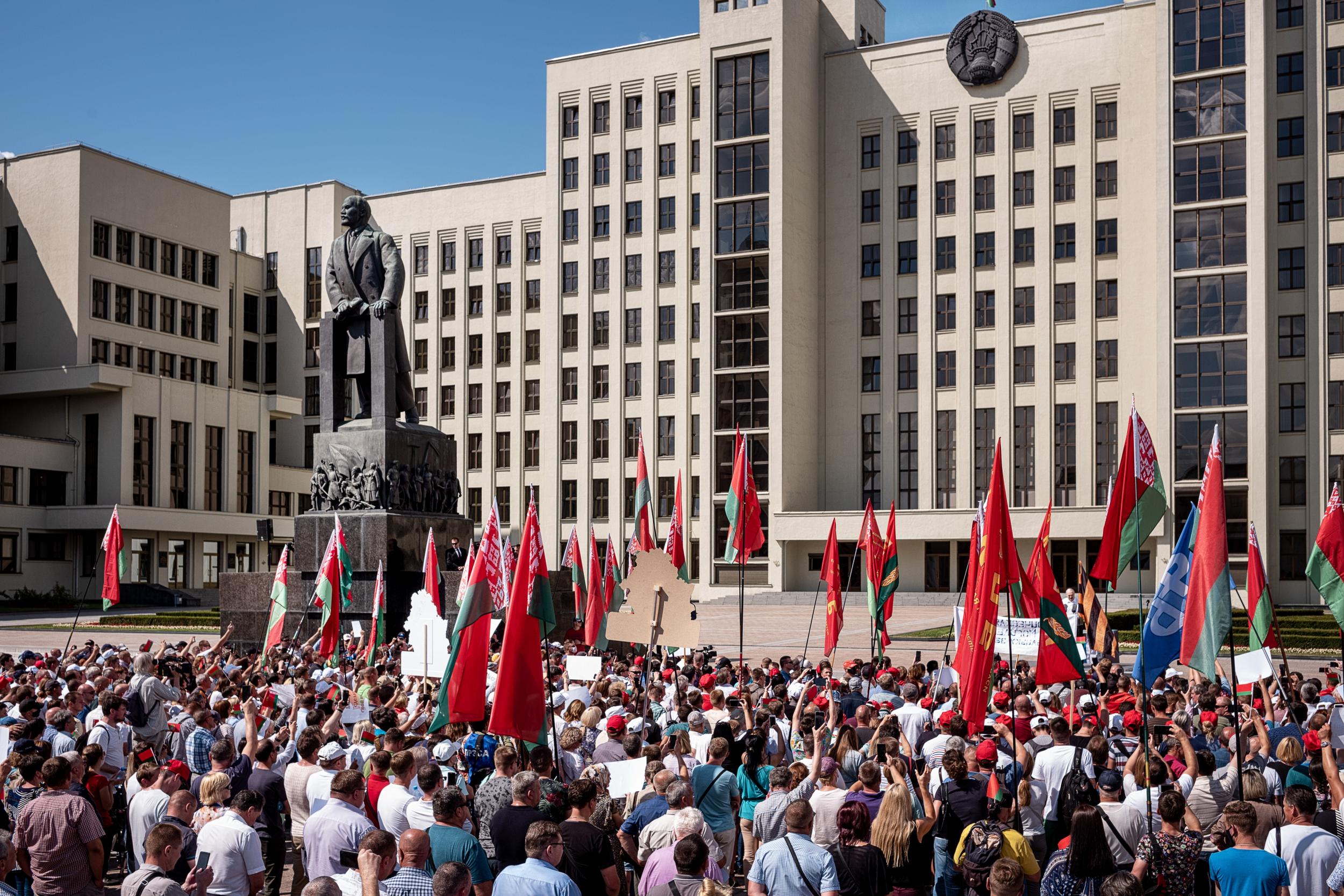 A crowd watch the Belarus leader in Minsk on Sunday: some of the people there are thought to have been brought in by authorities