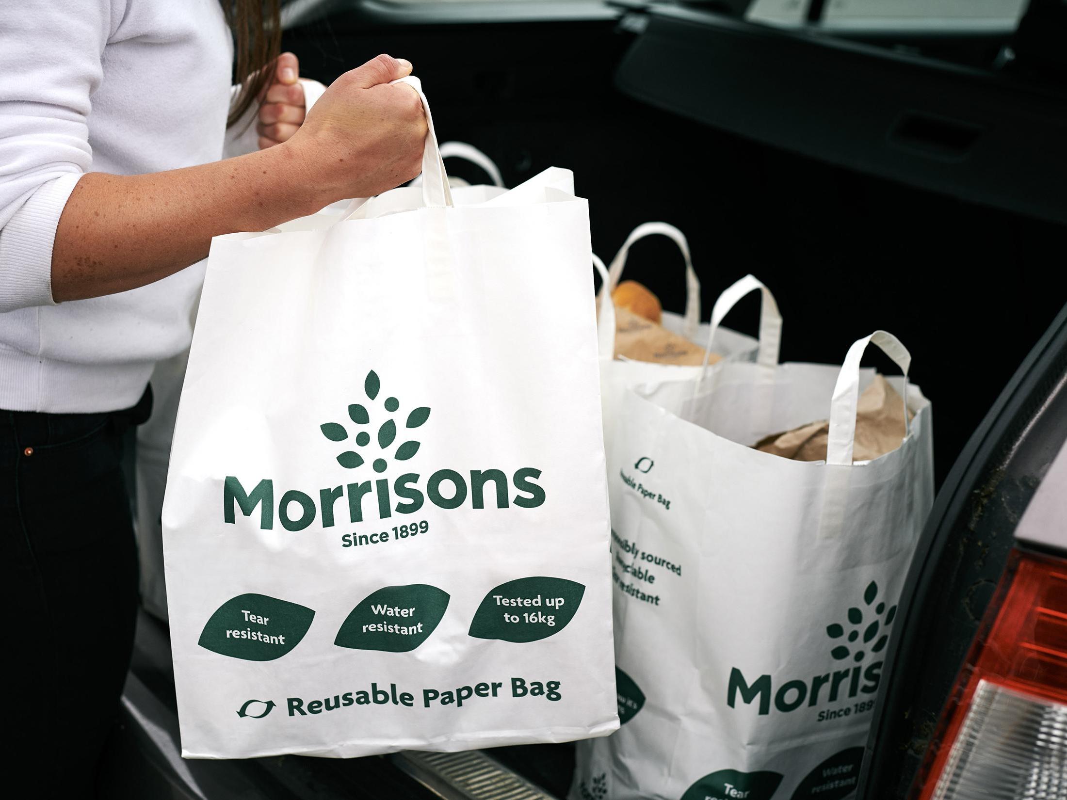 Morrison is running a trial in eight stores which will see the paper bags offered at checkouts instead of plastic bags for life