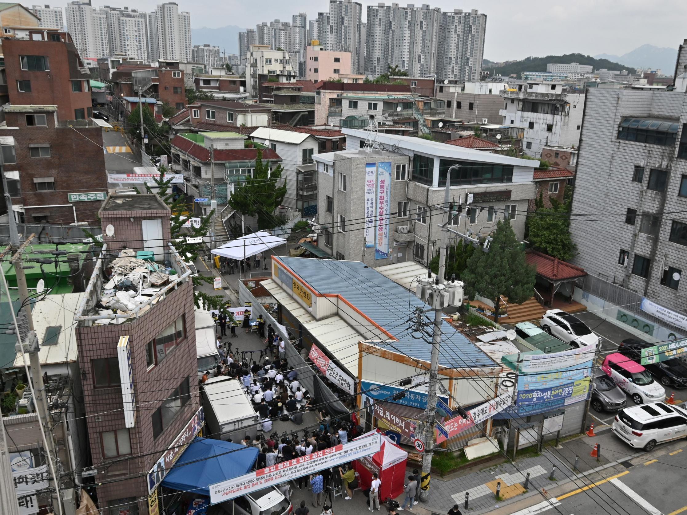 Government officials restrict access to Sarang Jeil Church while its lawyer held a press conference on Monday