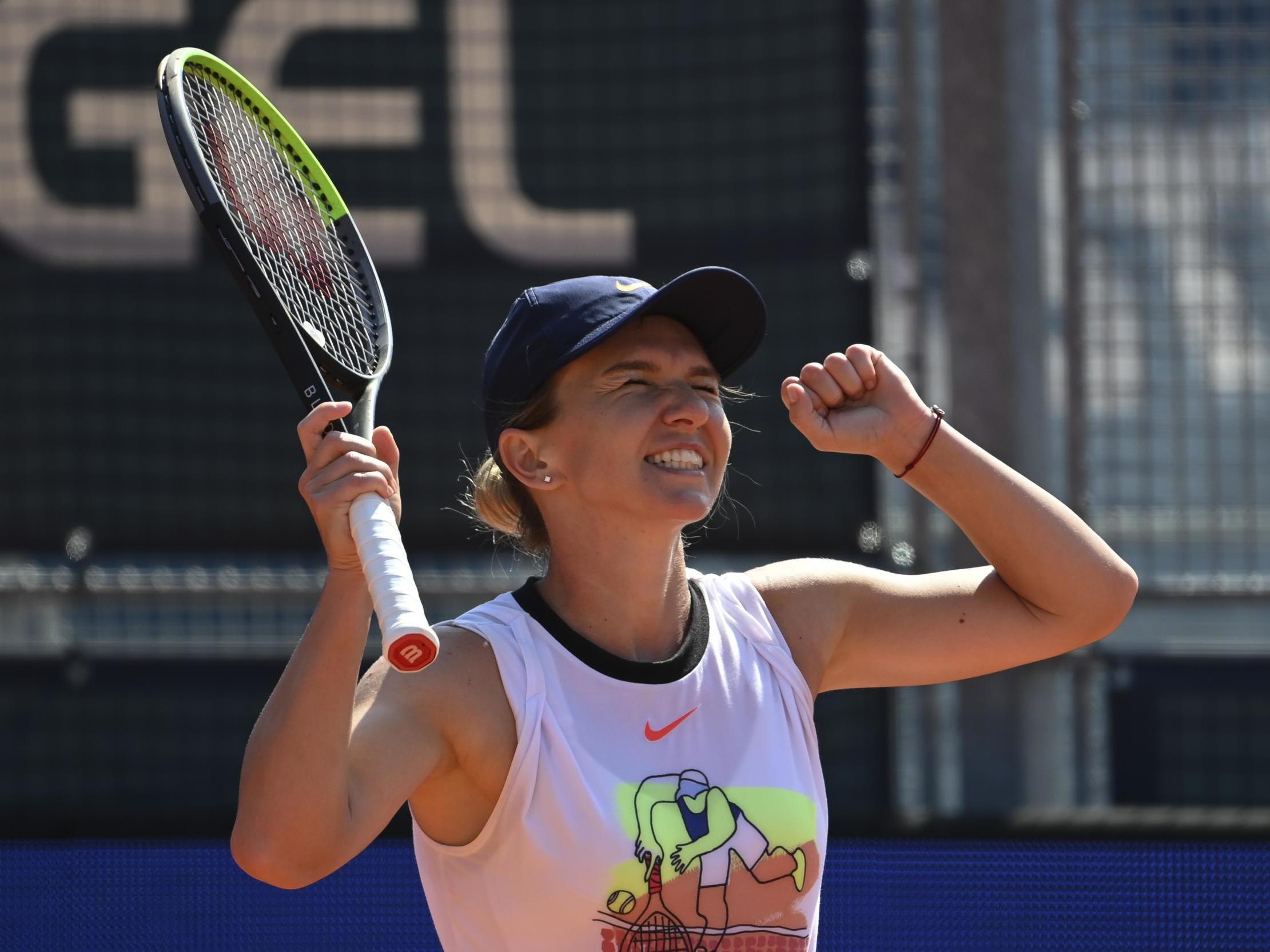 Halep celebrates winning the Prague Open