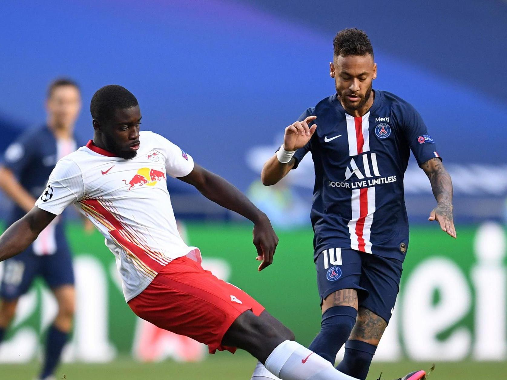 Leipzig’s Dayot Upamecano (L) fights for the ball with Paris Saint-Germain’s Neymar