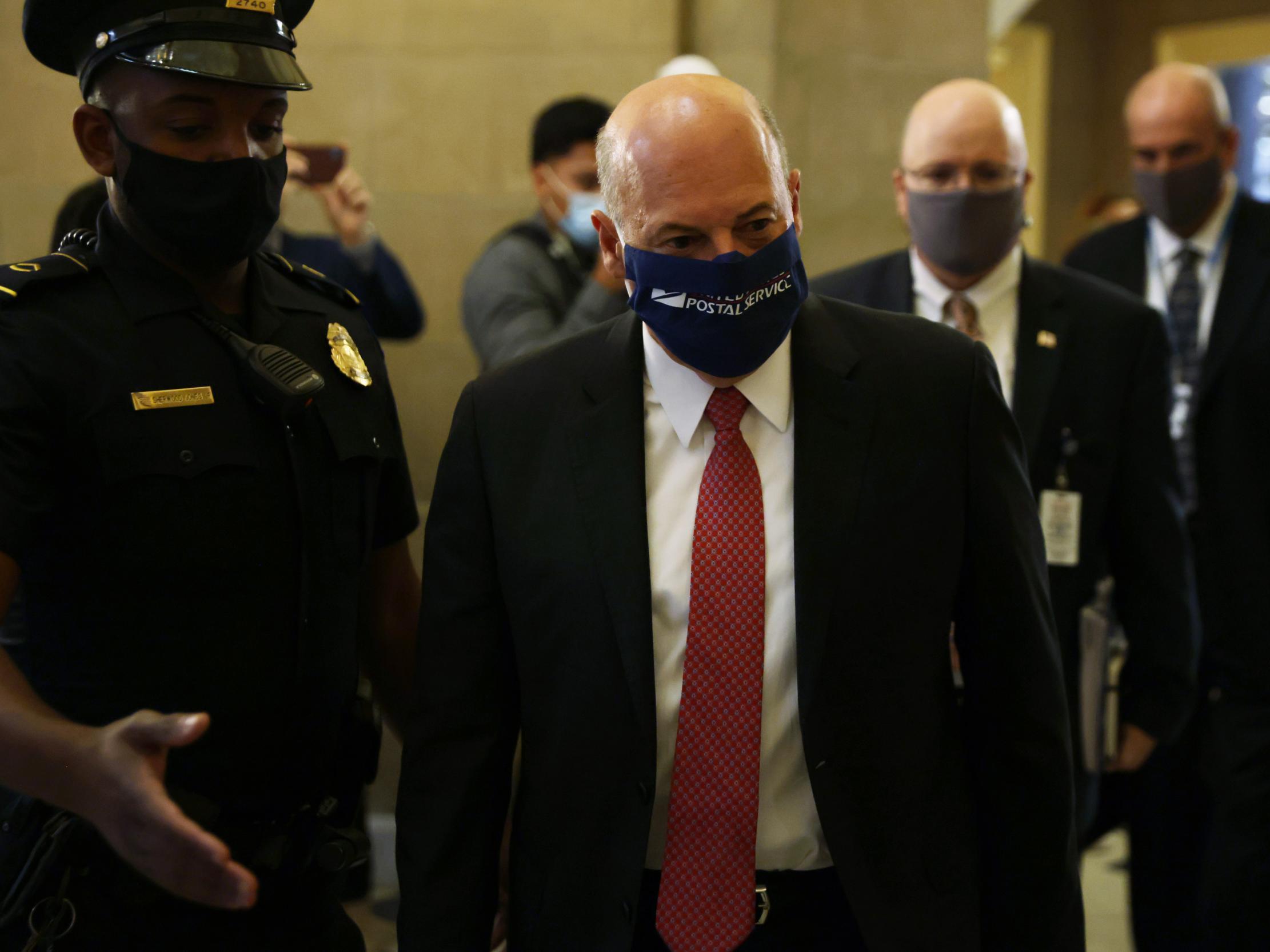 Louis DeJoy arrives at a meeting at the office of Nancy Pelosi