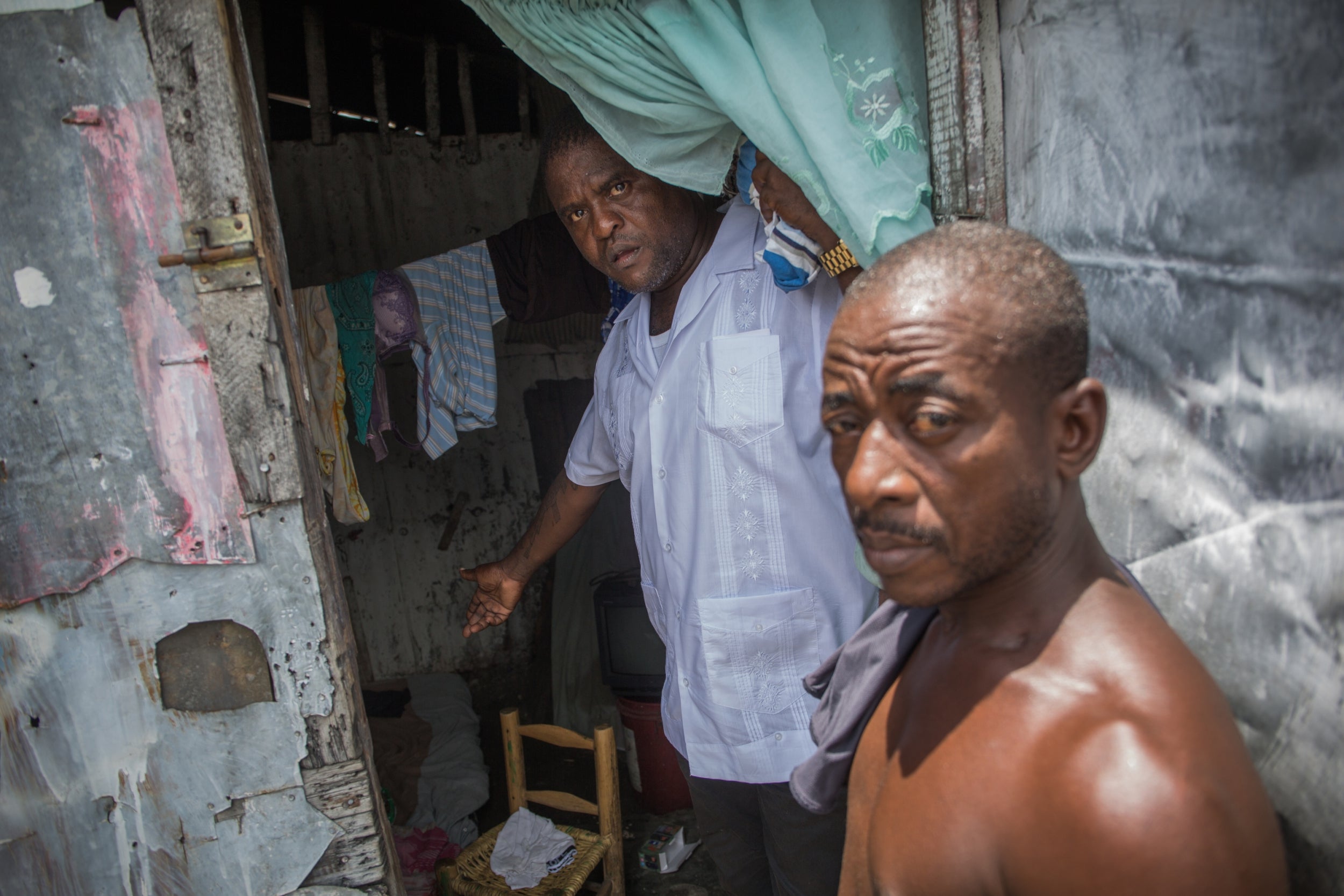 Cherizier shows the living conditions inside a resident’s shanty in the rundown slum of La Saline (The Washington Post/Pierre Michel Jean)