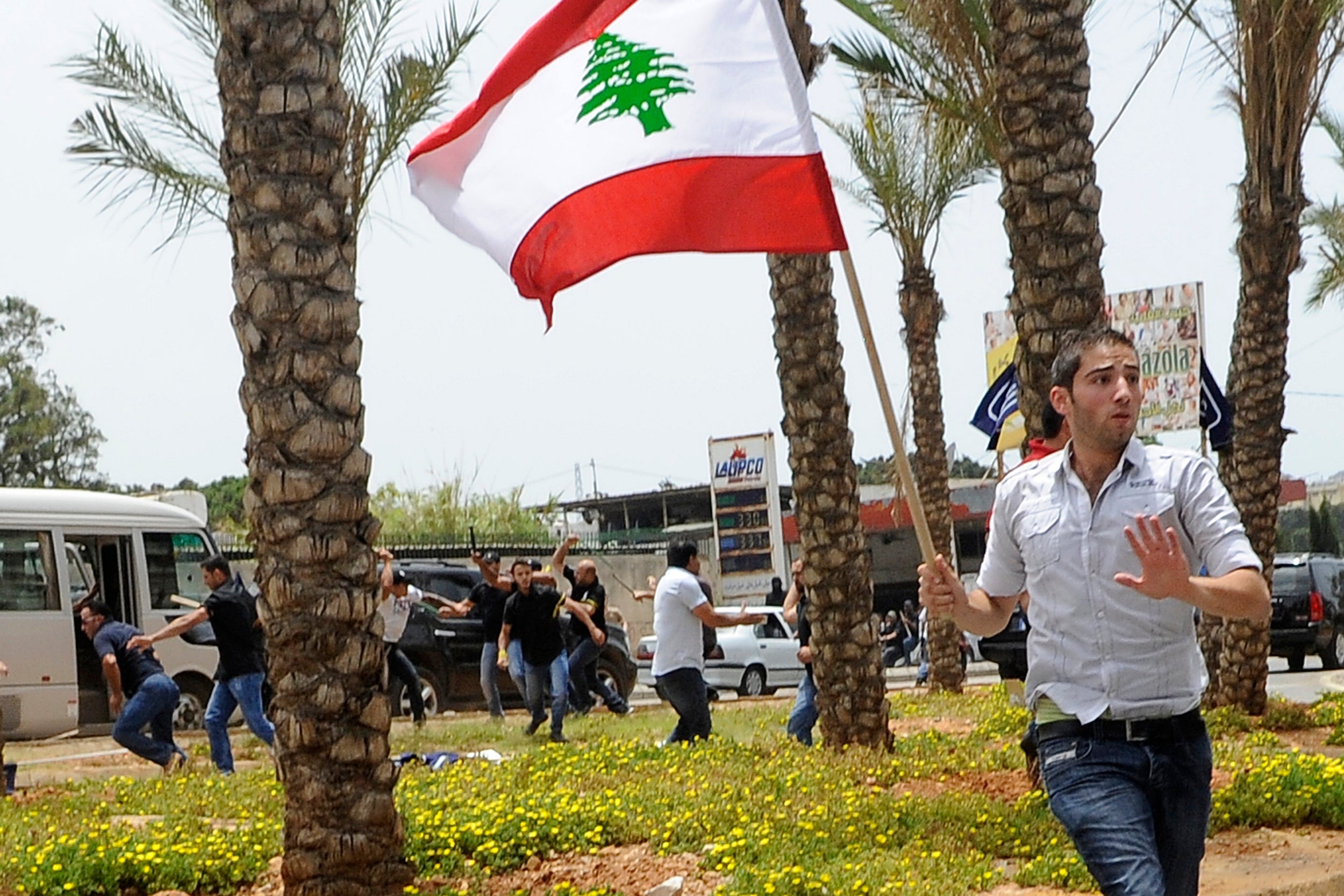 Supporters of the Lebanese Affiliation Party clash with security outside the Iranian embassy in Beirut during a protest over Hezbollah military intervention in Syria in 2013