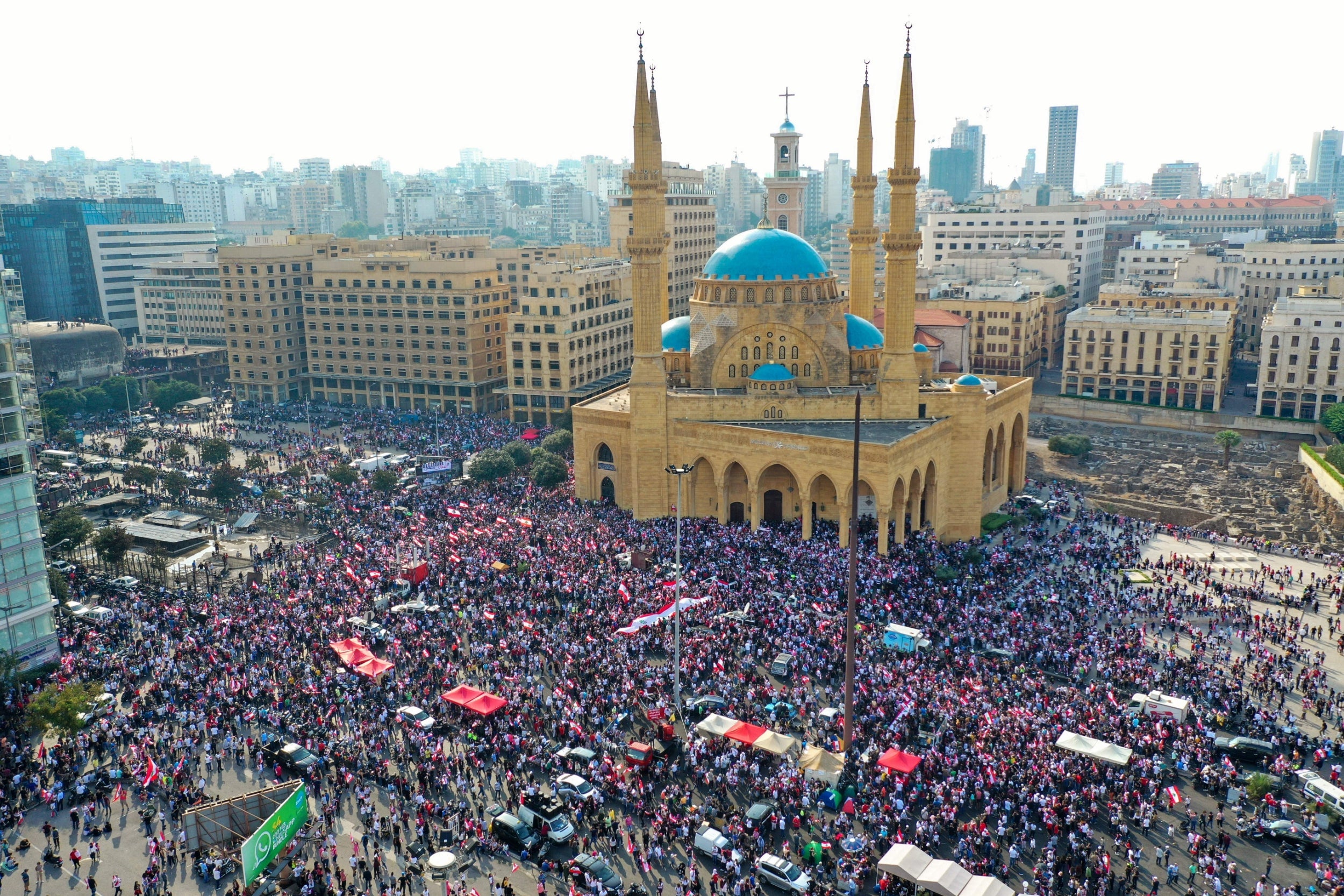 Protesters rally outside the Mohammad al-Amin Mosque on the fourth day of demonstrations against tax increases and corruption in October