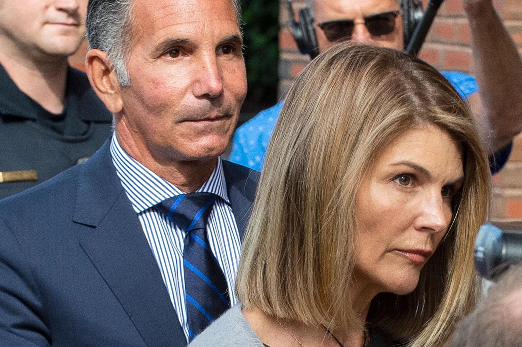 Lori Loughlin and Mossimo Giannulli exit the Boston Federal Court house after a pre-trial hearing on 27 August 2019.