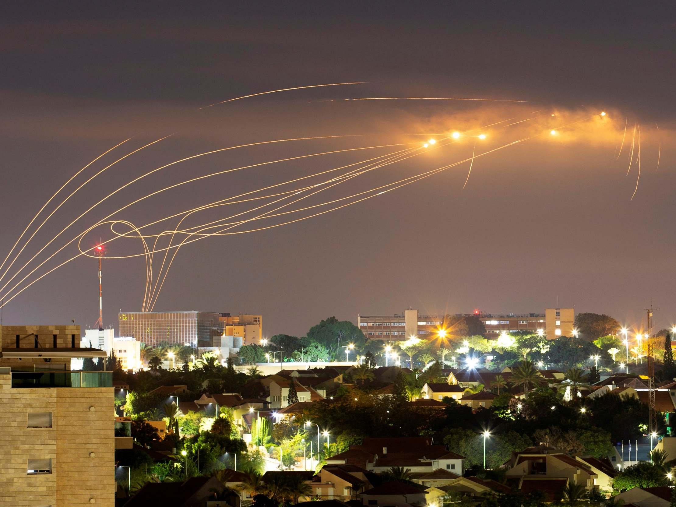 The Iron Dome anti-missile system fires interception missiles as rockets are launched from Gaza towards Israel, as seen from the city of Ashkelon, Israel