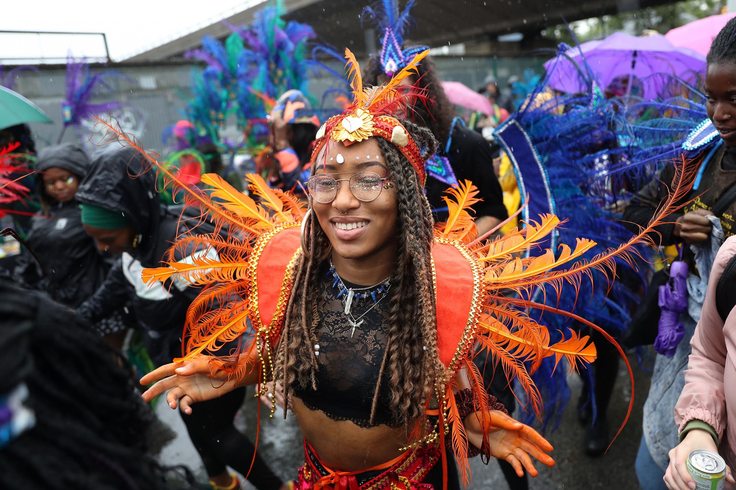 A carnival performer dances during the parade on the first day of the Notting Hill Carnival in west London on 26 August 2018