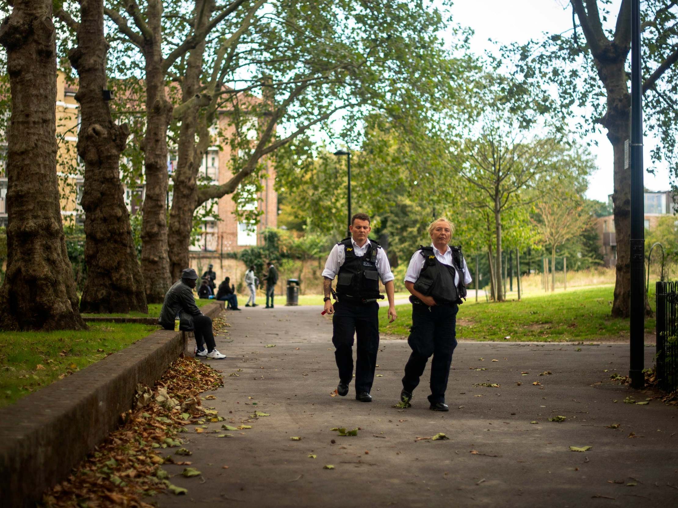 Police seen in Nursery Row Park, Walworth, where a 24-year-old man is believed to have been stabbed on Friday