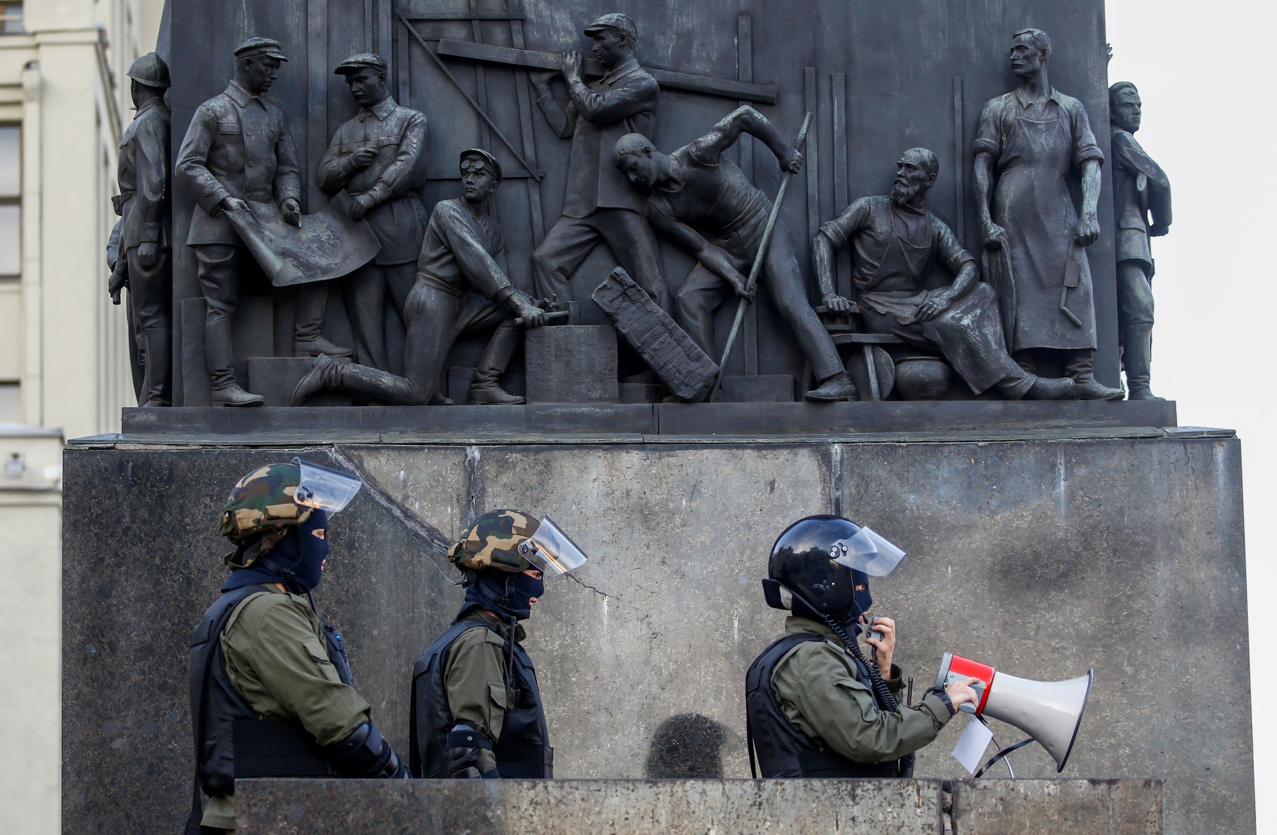 Law enforcement officers are seen during an opposition demonstration at the Independence Square in Minsk on Saturday (Reuters)