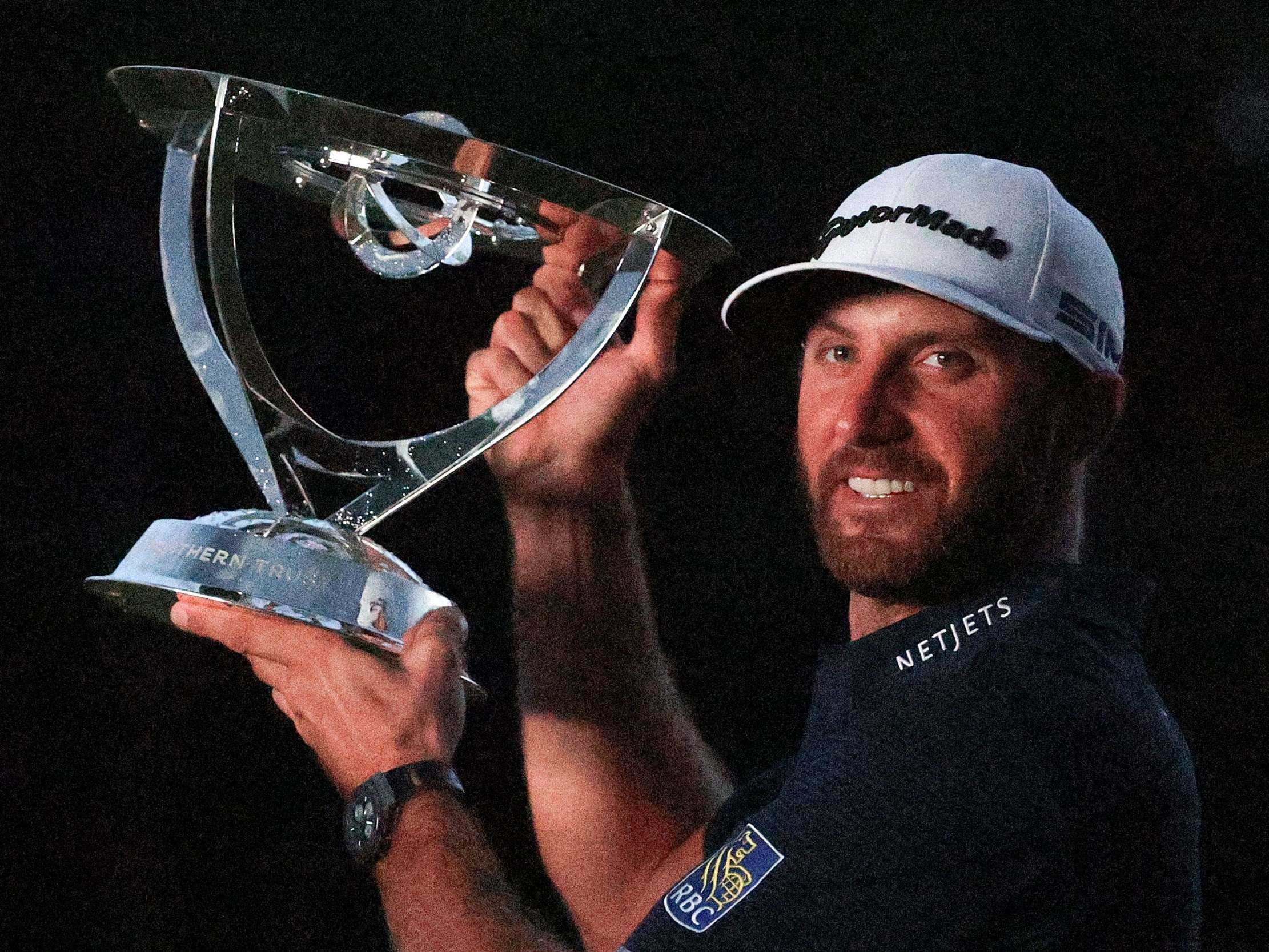 Dustin Johnson celebrates winning The Northern Trust