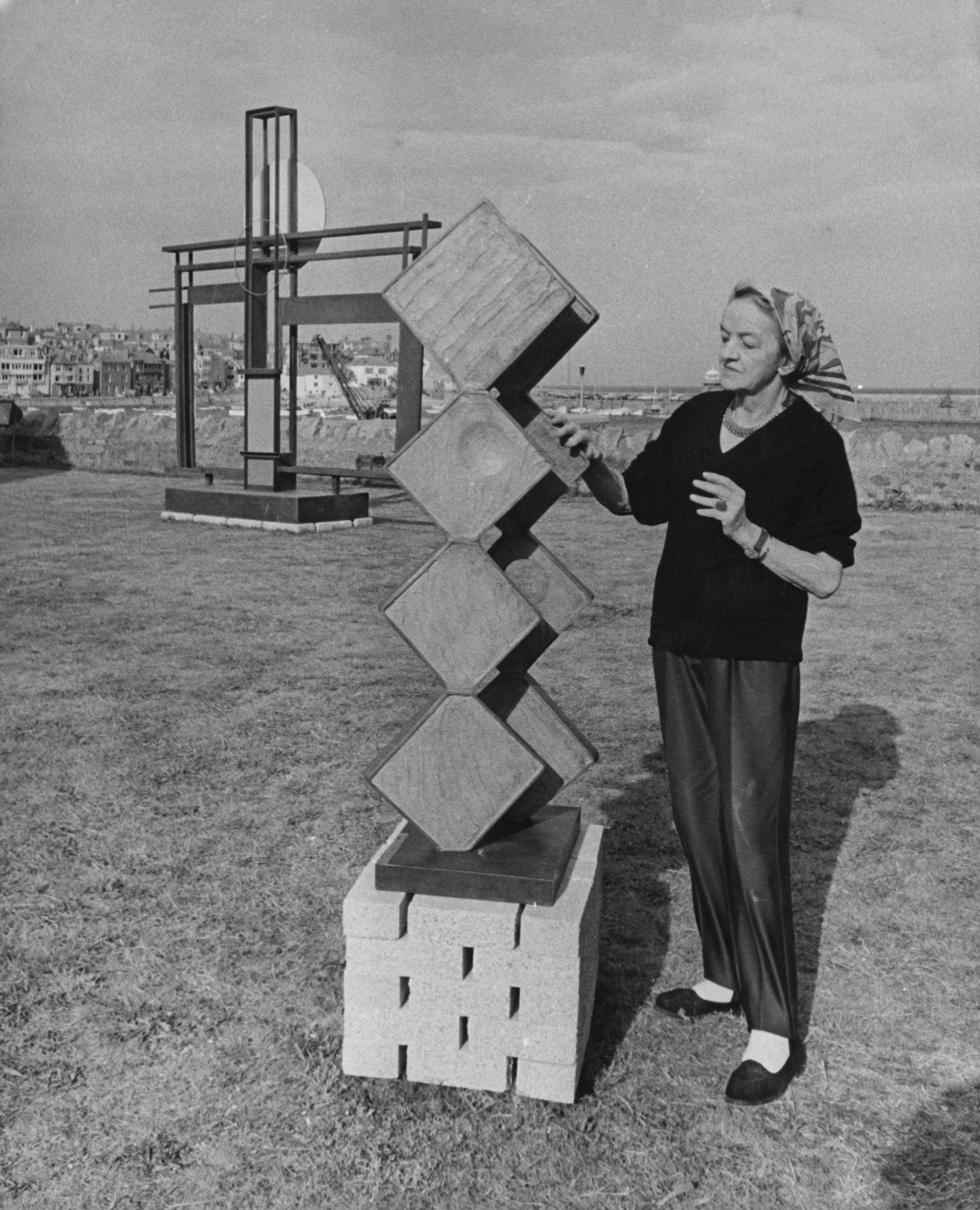 Hepworth with her sculpture 'Square Forms (Two Sequences)' in St Ives, Cornwall, on 23 September 1968. In the background is her work 'Construction (Crucifixion)'.