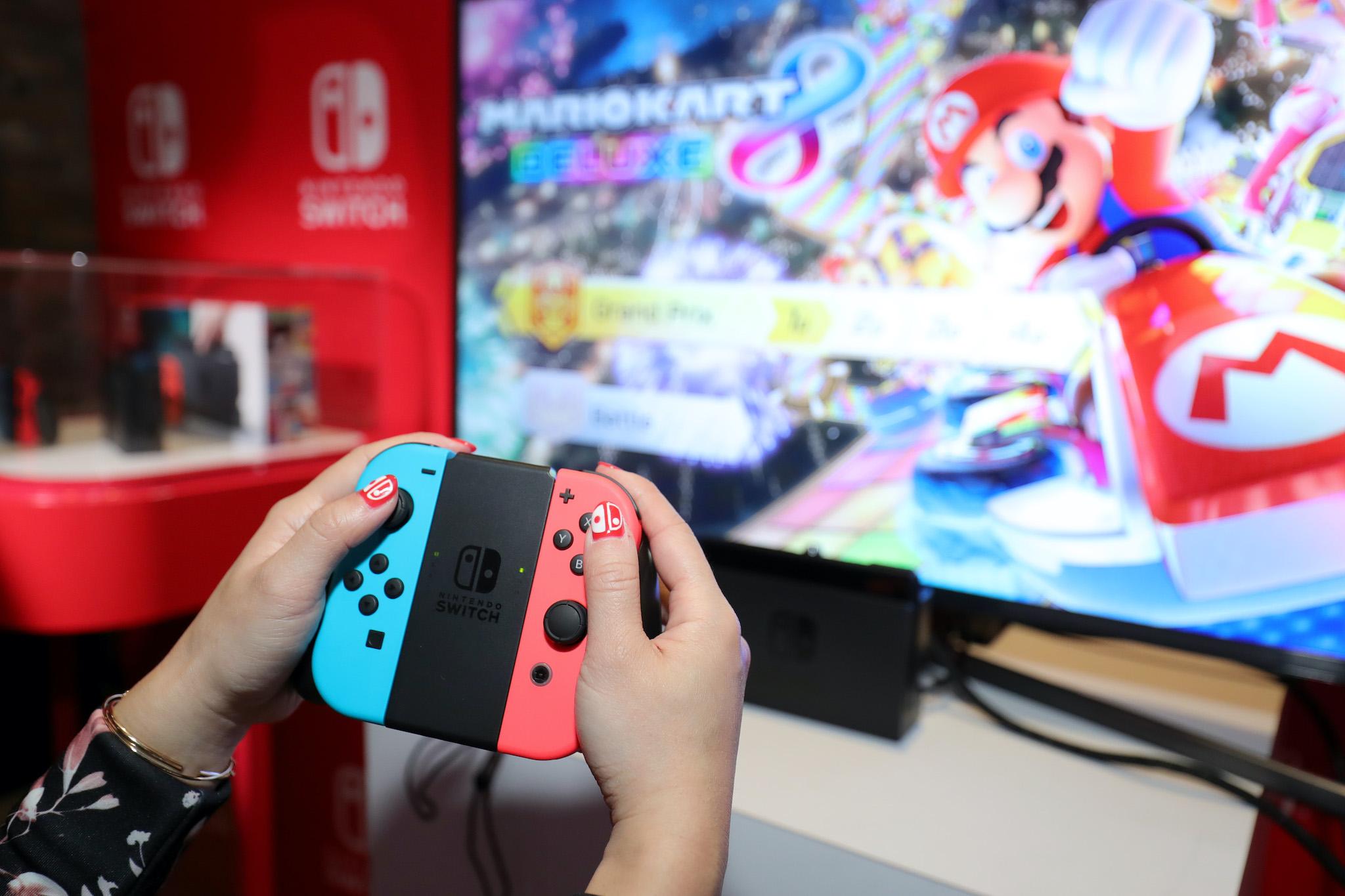 Nintendo of America, A guest enjoys playing Mario Kart 8 Deluxe on the groundbreaking new Nintendo Switch at a special preview event in New York on Jan. 13, 2017