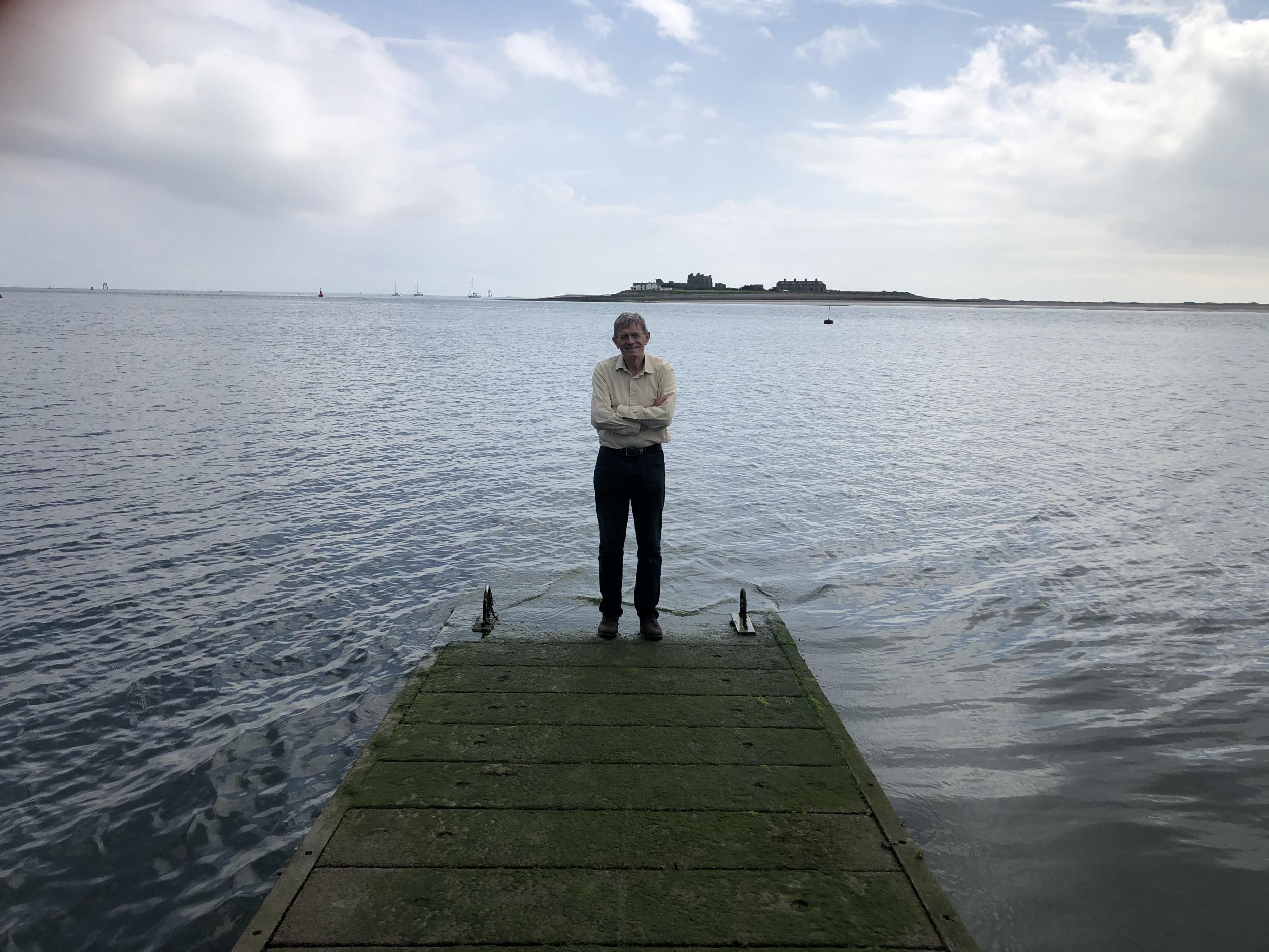 Distant dream: the author at the end of the jetty in Roa Island, with Piel Island and Walney Island in the background