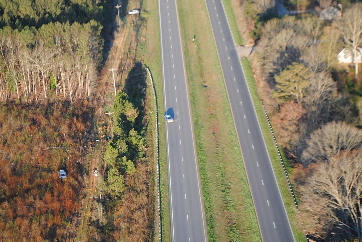 A minivan, left, crashed after a high-speed chase with a North Carolina Highway Patrol trooper in 2017