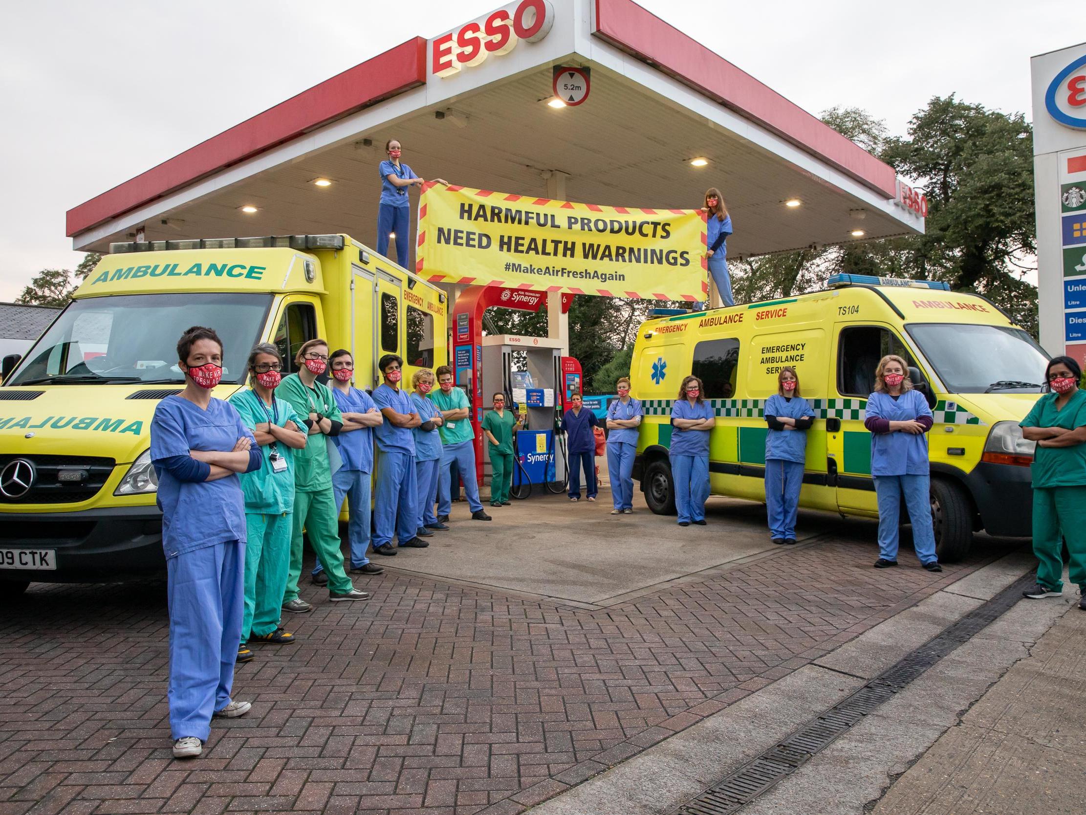 Activists from Doctors For Extinction Rebellion, an offshoot of the protest group made up of healthcare professionals, gather at a petrol station at Newham, London