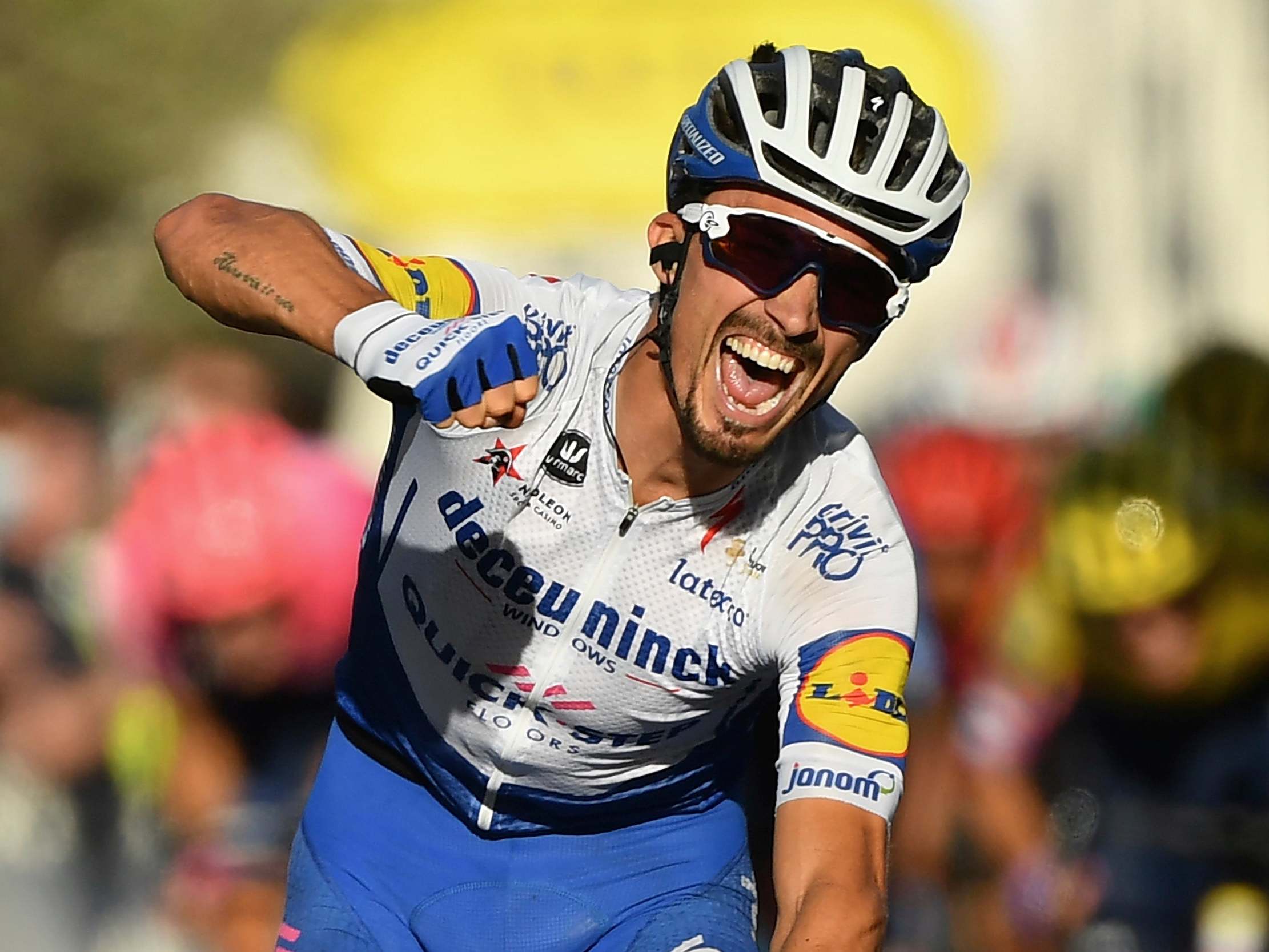 Julian Alaphilippe celebrates winning the stage