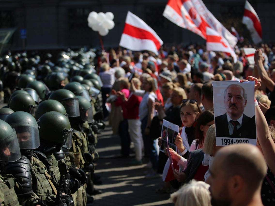 Law enforcement officers block a street during a rally of opposition supporters protesting against presidential election results in Minsk, Belarus